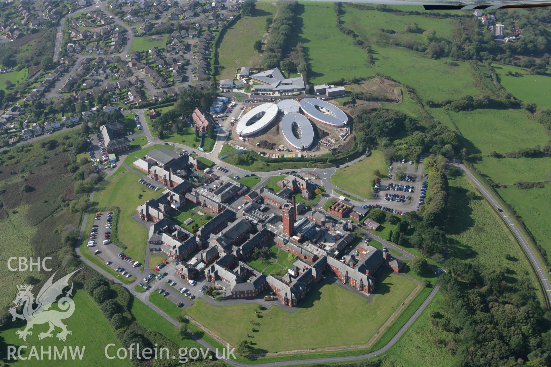 RCAHMW colour oblique photograph of Cefn Coed Hospital with new dementia unit, viewed from the east. Taken by Toby Driver and Oliver Davies on 28/09/2011.