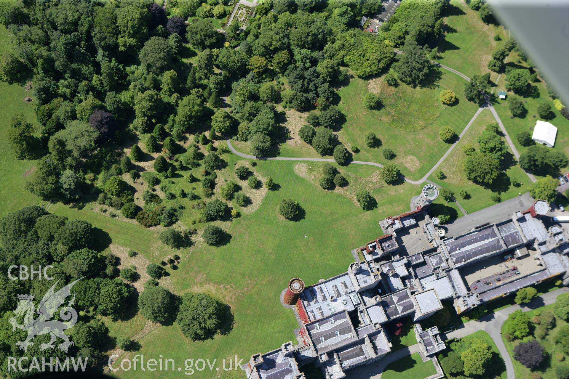 RCAHMW colour oblique photograph of Penrhyn Castle, Bangor, with parchmarks of unidentified ditch on south-west side of house. Taken by Toby Driver on 20/07/2011.