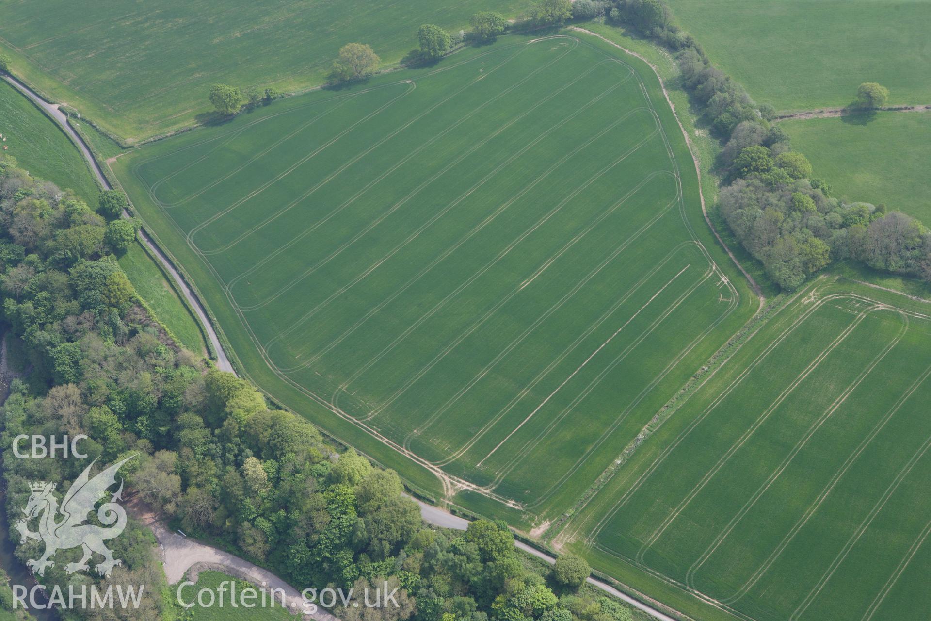 RCAHMW colour oblique photograph of Malthouse Road defended enclosure, cropmark. Taken by Toby Driver on 26/04/2011.