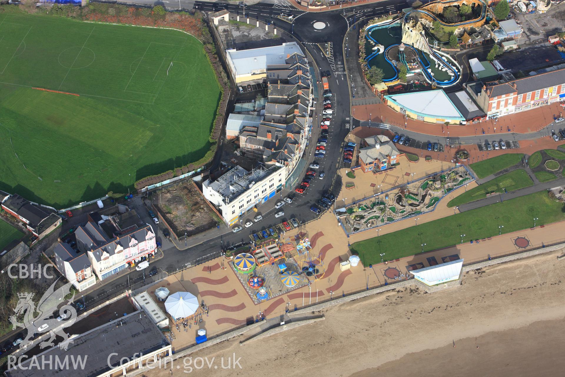 RCAHMW colour oblique photograph of Barry seafront, with the Promenade Cafe and seasonal funfair. Taken by Toby Driver on 17/11/2011.