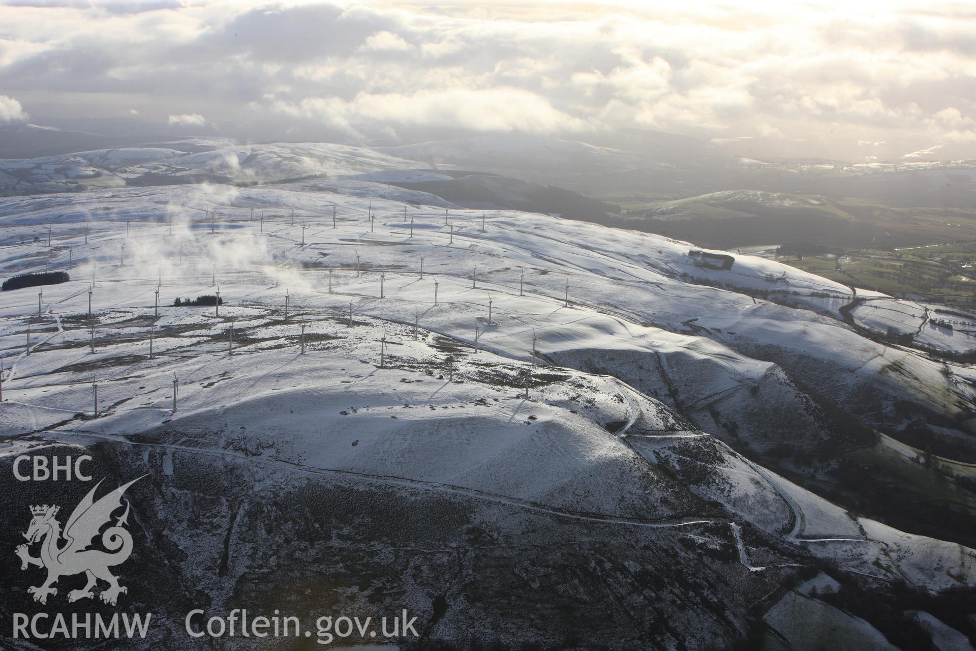 RCAHMW colour oblique photograph of Dethenydd windfarm, view under snow, looking south. Taken by Toby Driver on 18/12/2011.