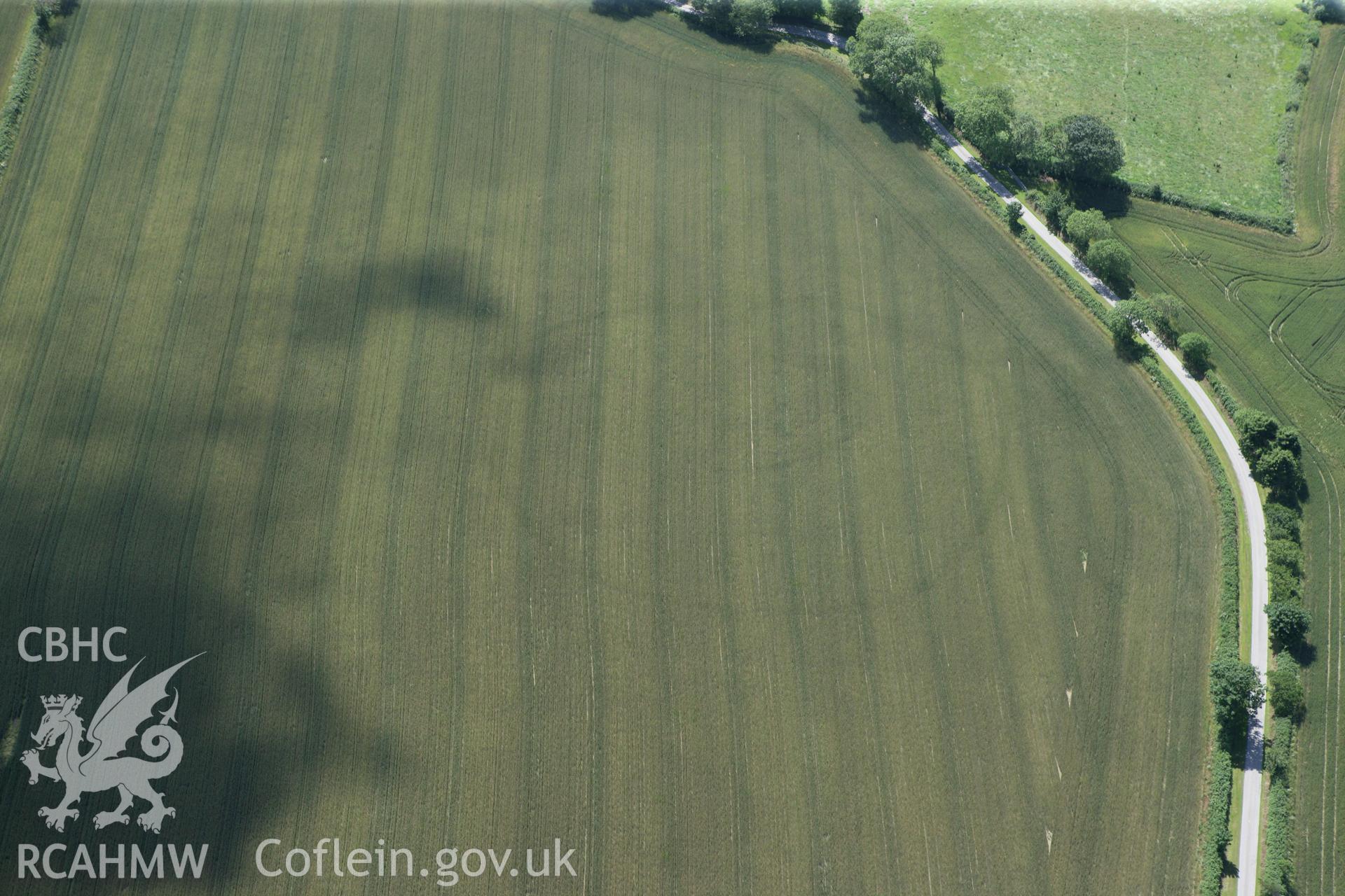 RCAHMW colour oblique photograph of Cawrence Cropmark Enclosure. Taken by Toby Driver and Oliver Davies on 28/06/2011.