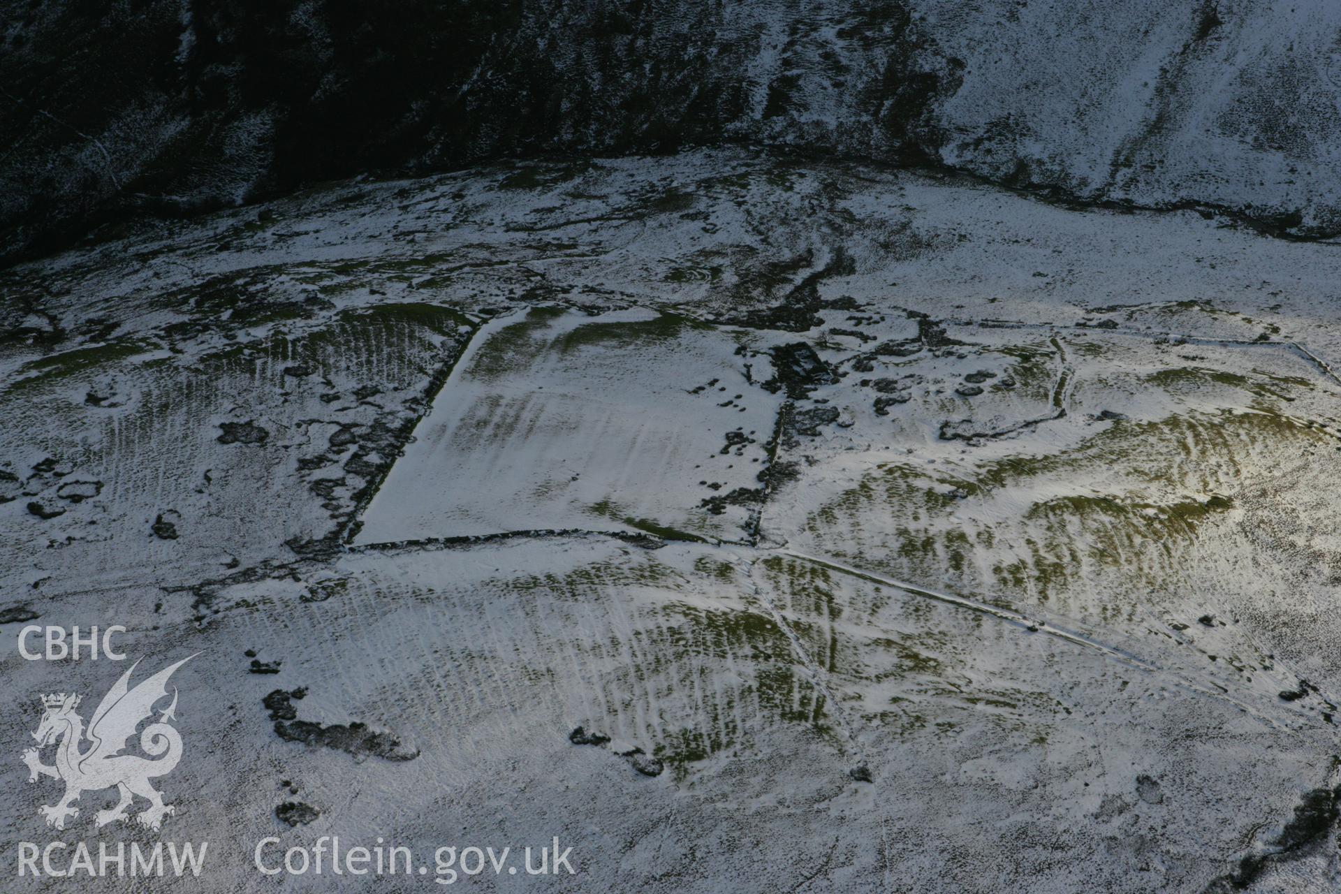 RCAHMW colour oblique photograph of Lluest-Pen-Rhiw, view from north under snow. Taken by Toby Driver on 18/12/2011.