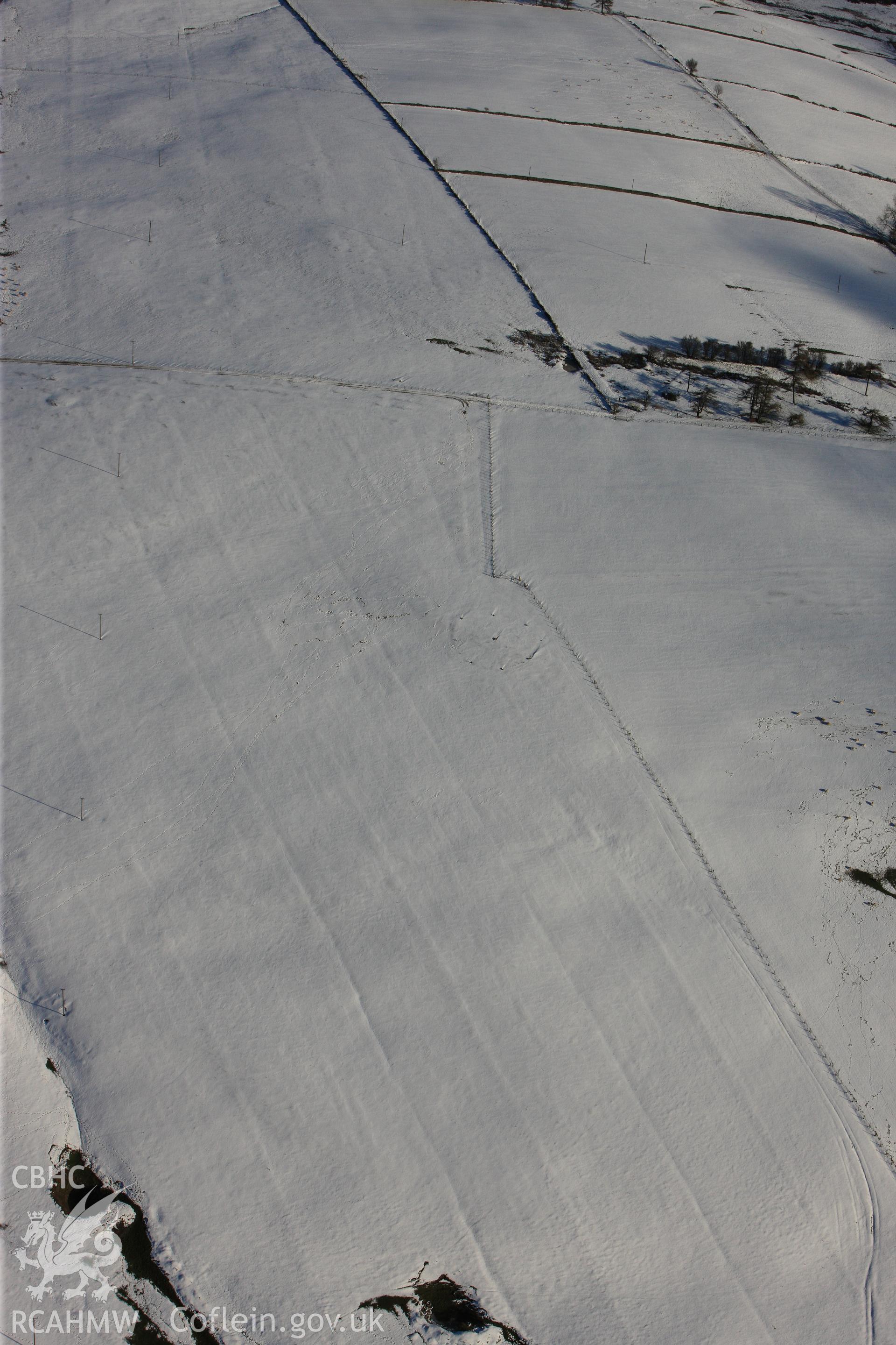 RCAHMW colour oblique photograph of Kerry Hill stone circle, under snow. Taken by Toby Driver on 18/12/2011.