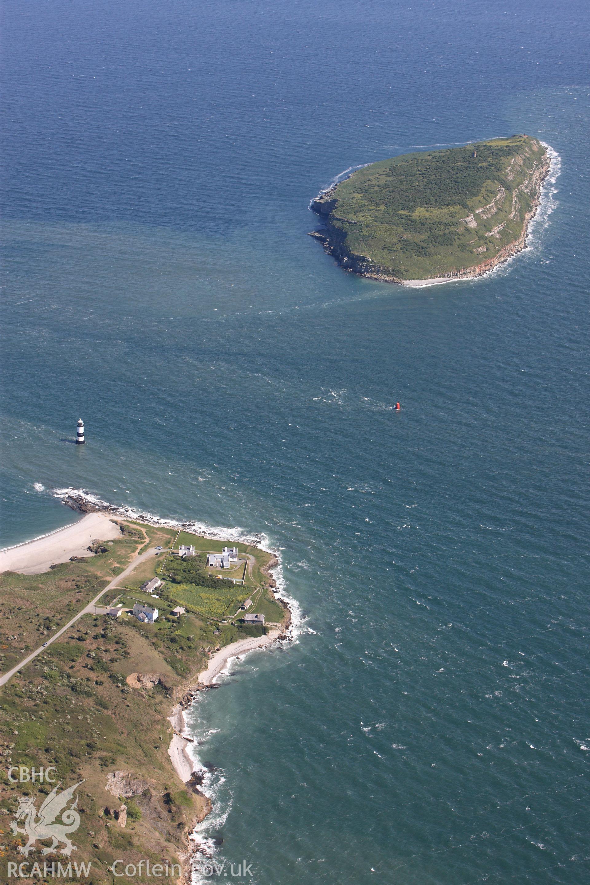 RCAHMW colour oblique photograph of Pilots Cottages, with Puffin Island and Trwyn-Du Lighthouse, Black Point. Taken by Toby Driver on 03/05/2011.