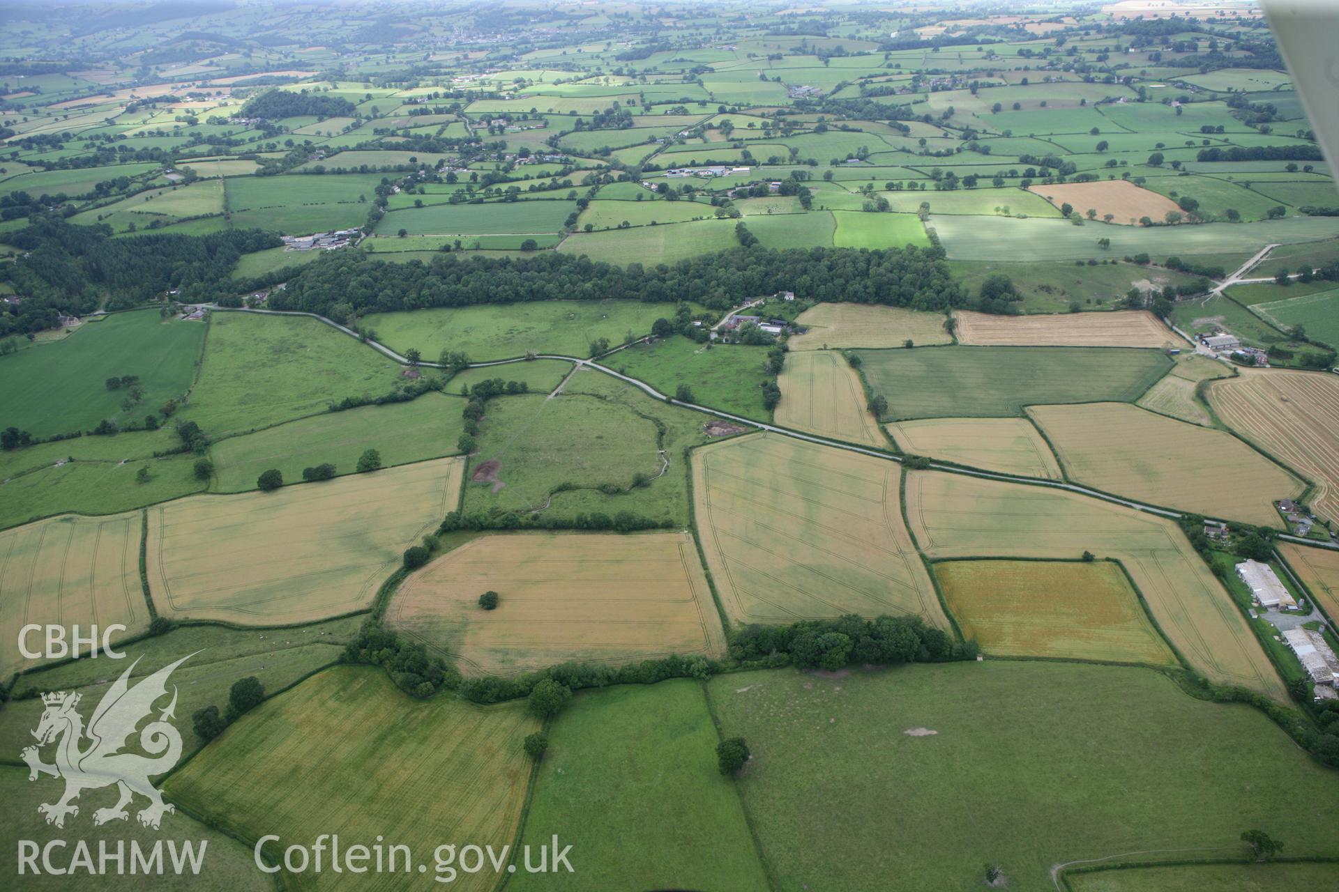 RCAHMW colour oblique photograph of Penthryn Fechan cropmarks, general location view. Taken by Toby Driver on 20/07/2011.