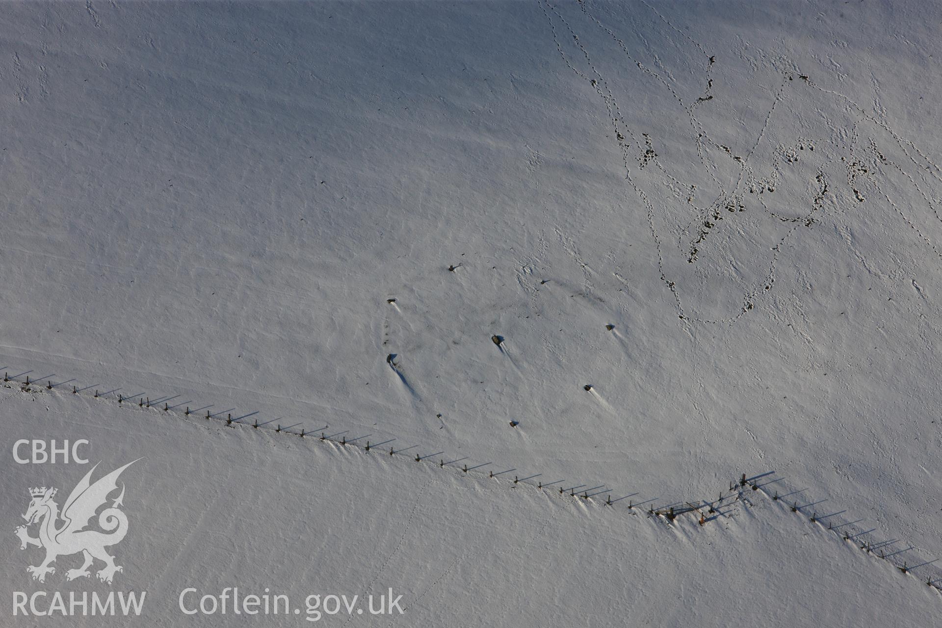 RCAHMW colour oblique photograph of Kerry Hill stone circle, under snow. Taken by Toby Driver on 18/12/2011.