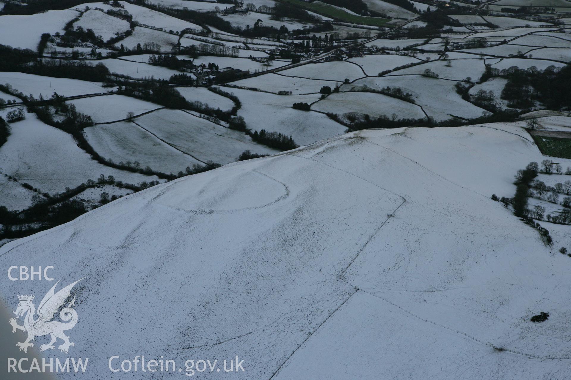 RCAHMW colour oblique photograph of Llyssin hillfort, SAM recommendation. Taken by Toby Driver on 18/12/2011.