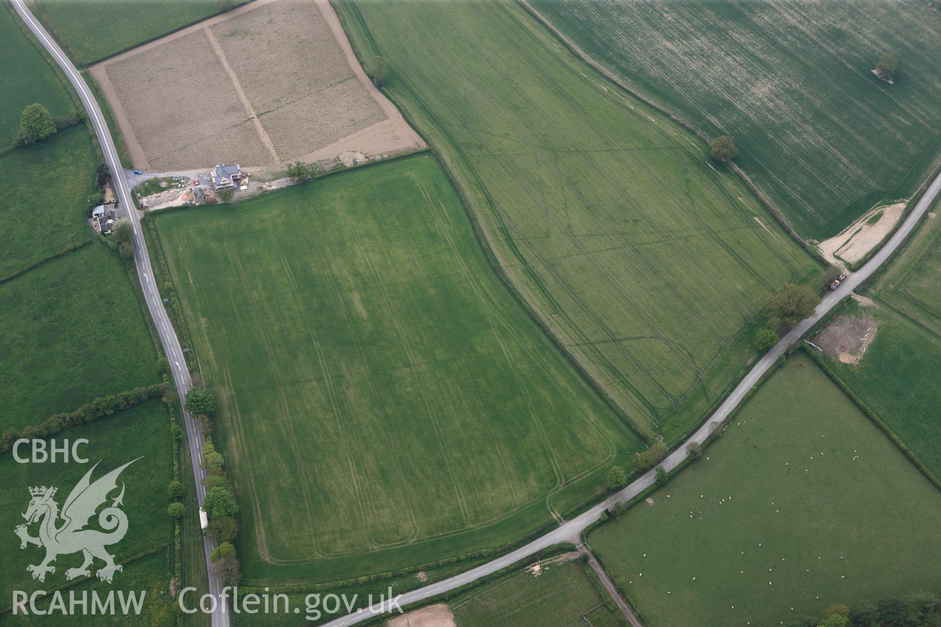 RCAHMW colour oblique photograph of Brompton or Pentrehyling Roman marching camps. Taken by Toby Driver on 26/04/2011.