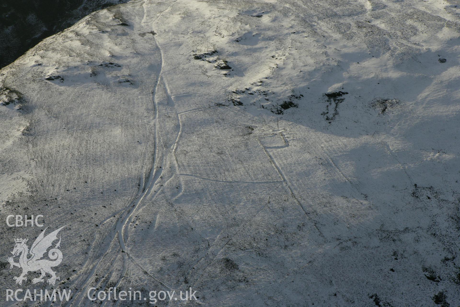 RCAHMW colour oblique photograph of Moelfryn, Nannerth, deserted rural settlement under snow. Taken by Toby Driver on 18/12/2011.