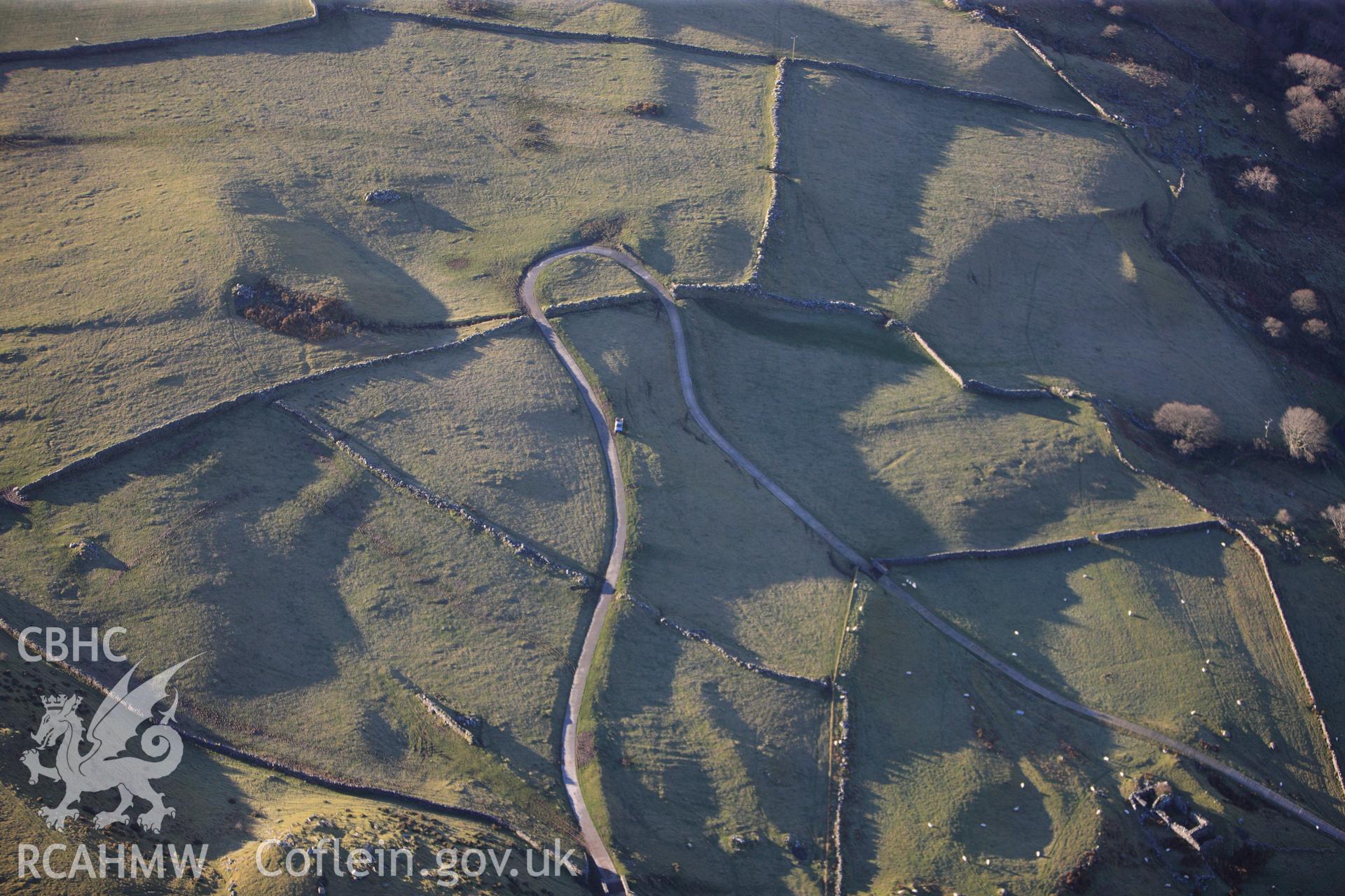 RCAHMW colour oblique photograph of Erw Wen, circular hut circle and field system. Taken by Toby Driver on 10/12/2012.