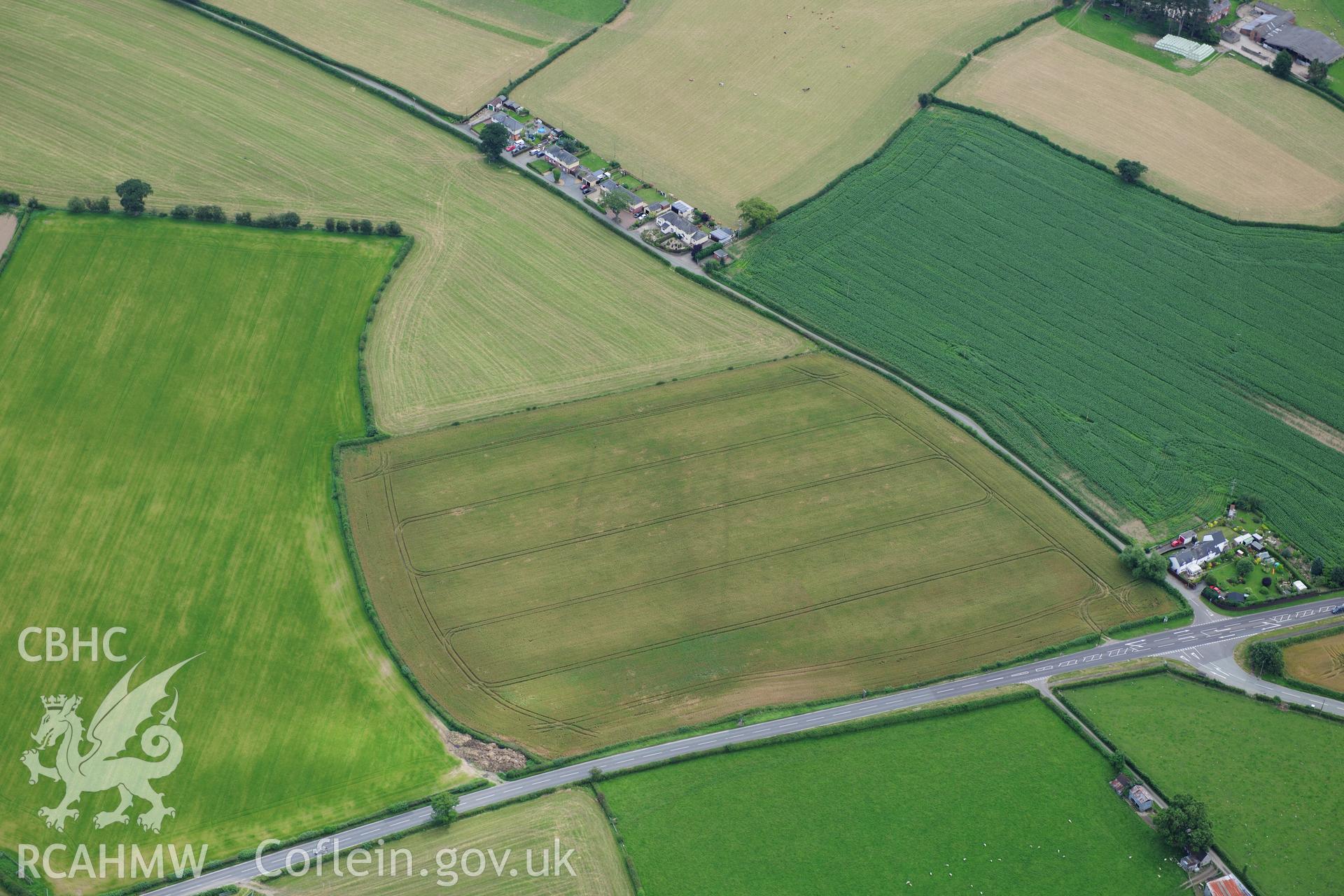 RCAHMW colour oblique photograph of Lower Luggy cursus, Dyffryn Lane, cropmarks. Taken by Toby Driver on 27/07/2012.