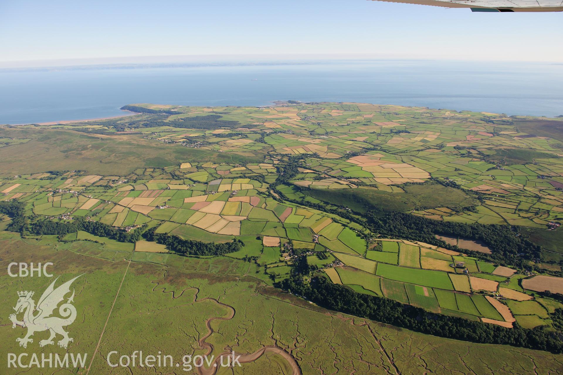 RCAHMW colour oblique photograph of West Gower, high landscape view over Landimore. Taken by Toby Driver on 24/07/2012.