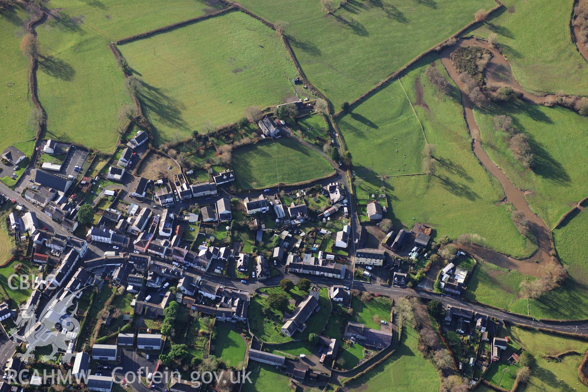 RCAHMW colour oblique photograph of Llangadog, with St Cadog's Church. Taken by Toby Driver on 23/11/2012.