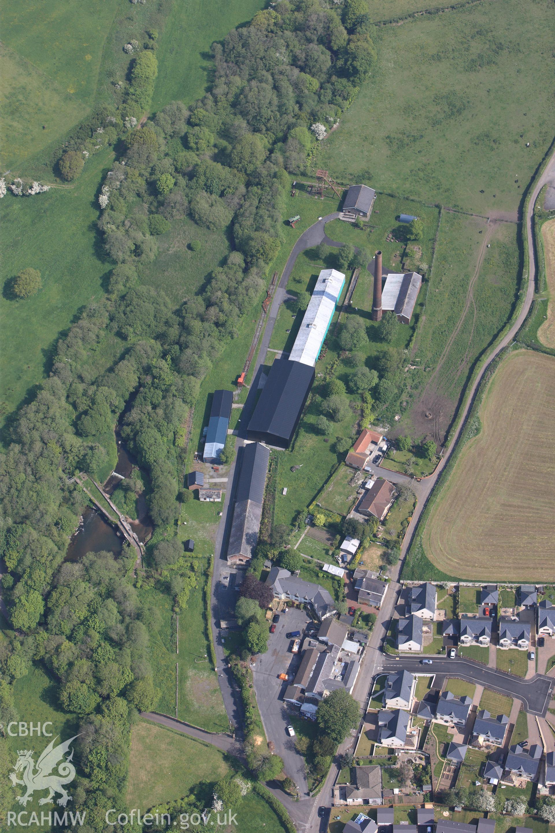 RCAHMW colour oblique photograph of General view of Kidwelly tinplate works, looking north. Taken by Toby Driver on 24/05/2012.