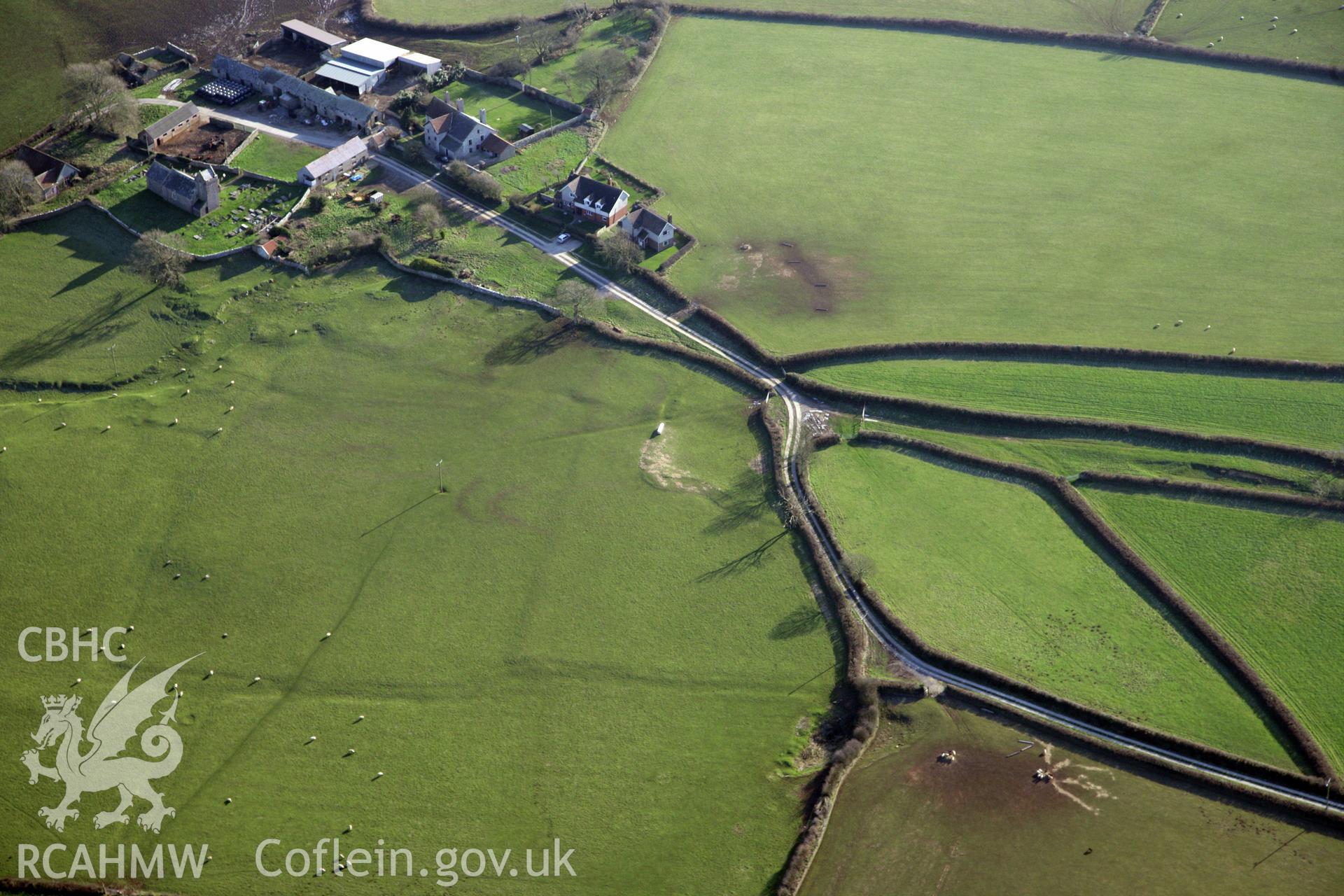 RCAHMW colour oblique photograph of Llanddewi  Earthworks. Taken by Toby Driver on 02/02/2012.