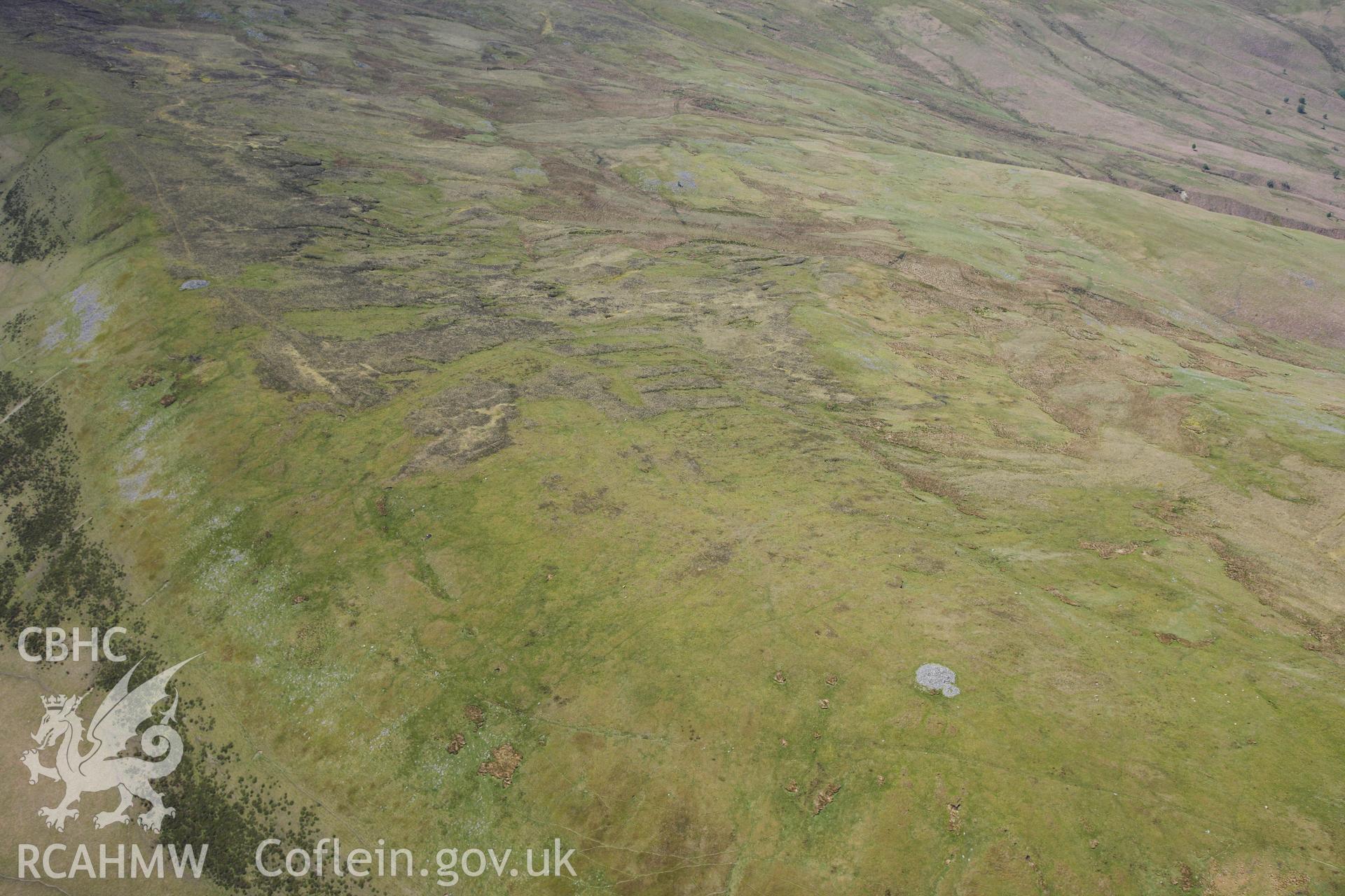 RCAHMW colour oblique photograph of Long-shot: Graig Ddu, Cairn II. Taken by Toby Driver on 28/05/2012.