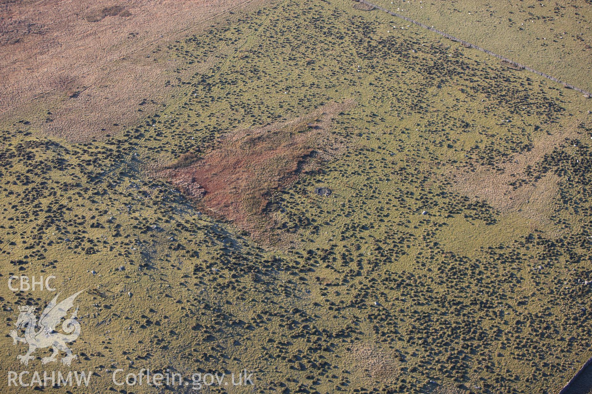 RCAHMW colour oblique photograph of Mynydd Egryn, excavated hut circle. Taken by Toby Driver on 10/12/2012.