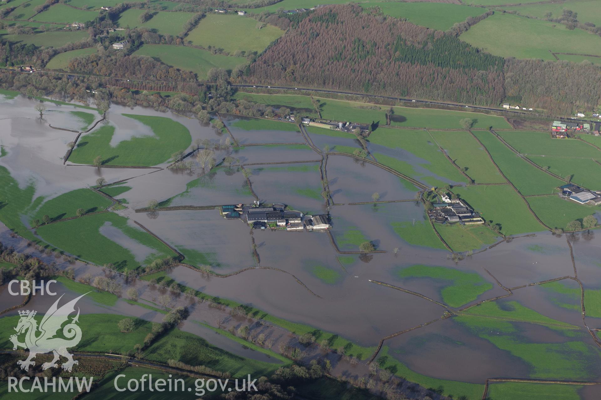 RCAHMW colour oblique photograph of Glynmyrddin and Glantowy Fawr farms, with flooding, view from south. Taken by Toby Driver on 23/11/2012.