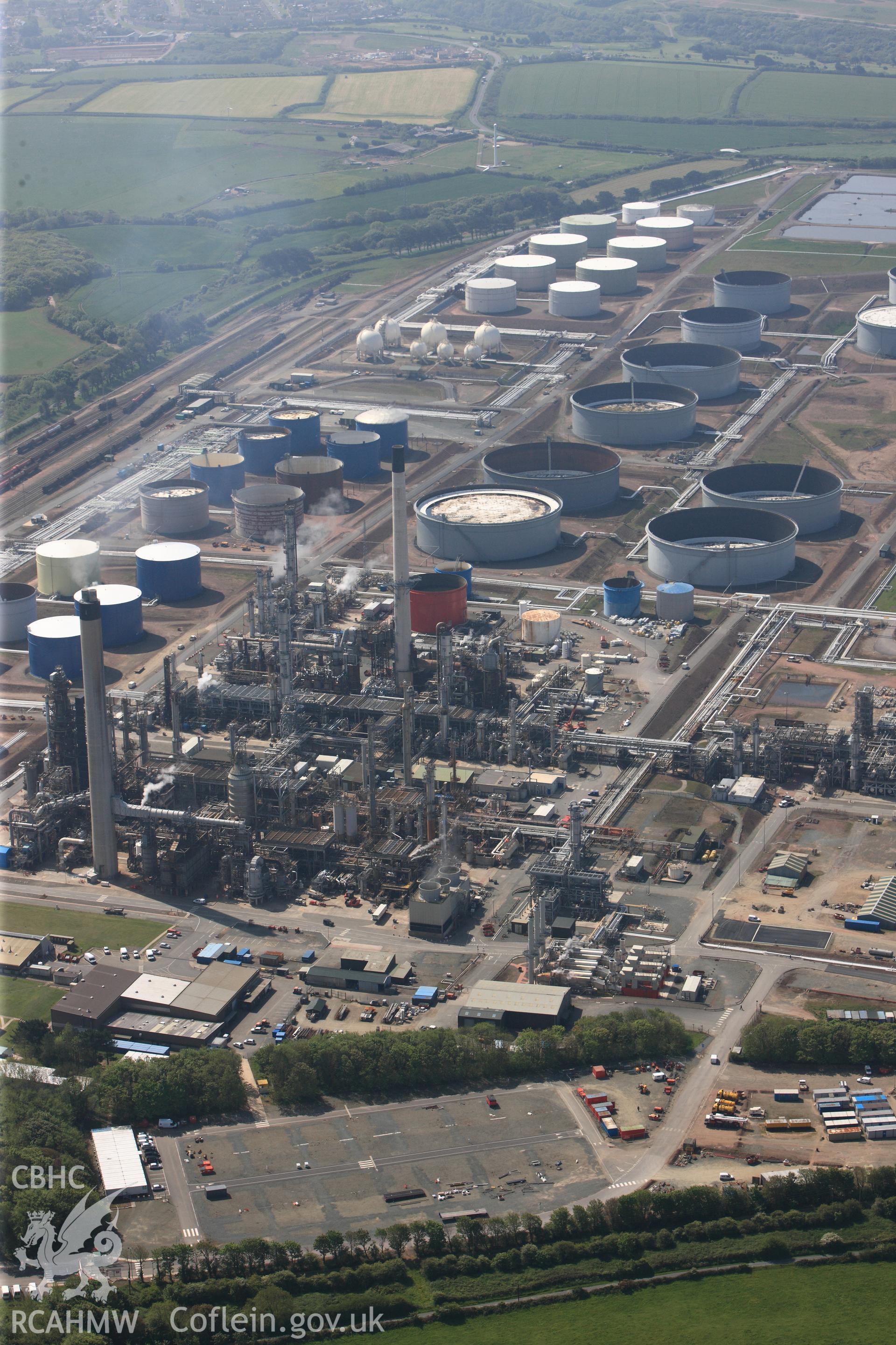 RCAHMW colour oblique photograph of General view of Amoco oil refinery, looking south. Taken by Toby Driver on 24/05/2012.
