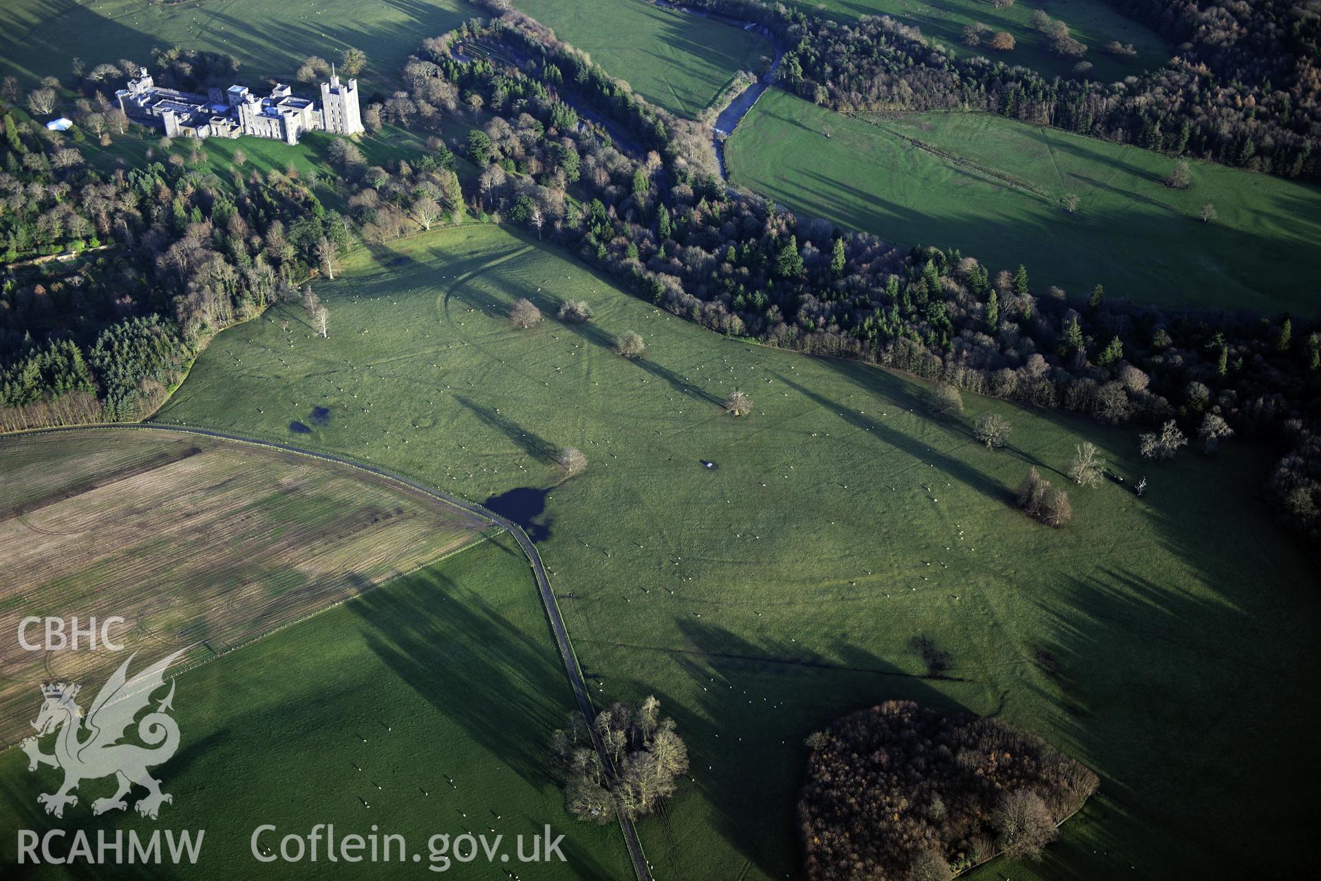 RCAHMW colour oblique photograph of Penrhyn Park earthworks. Taken by Toby Driver on 10/12/2012.