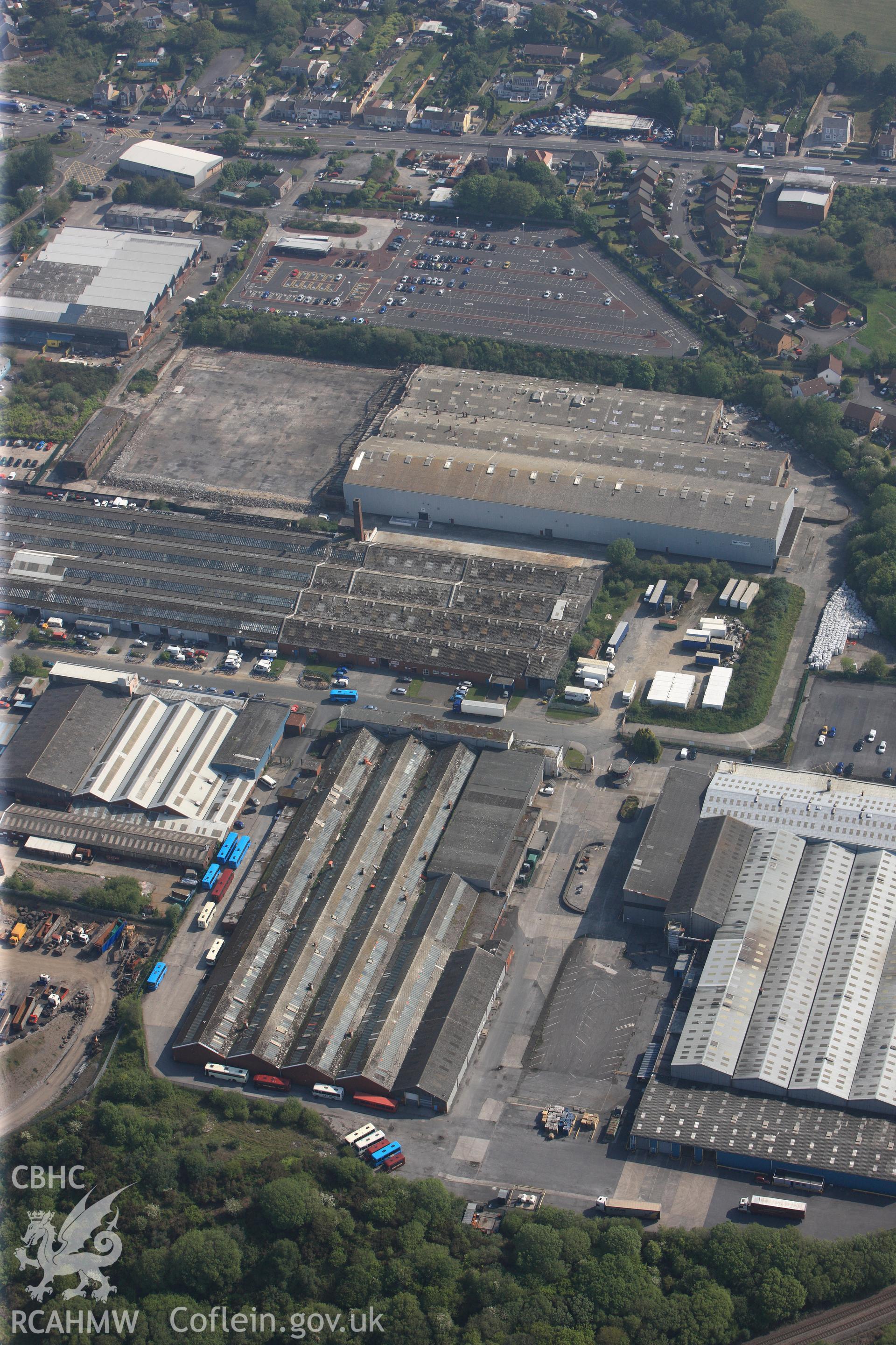 RCAHMW colour oblique photograph of General view of Swansea West Industrial Estate including former War Materials factory, looking north east. Taken by Toby Driver on 24/05/2012.