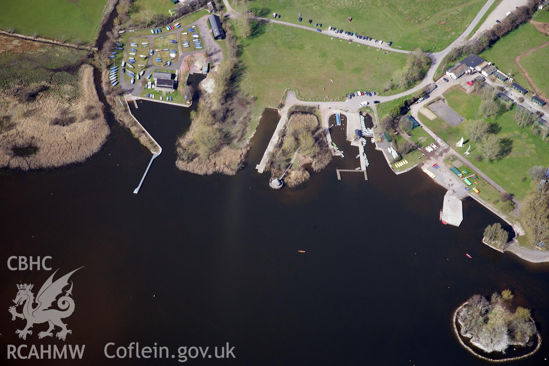 RCAHMW colour oblique photograph of The Welsh Crannog Centre, Llangorse. Taken by Toby Driver and Oliver Davies on 28/03/2012.