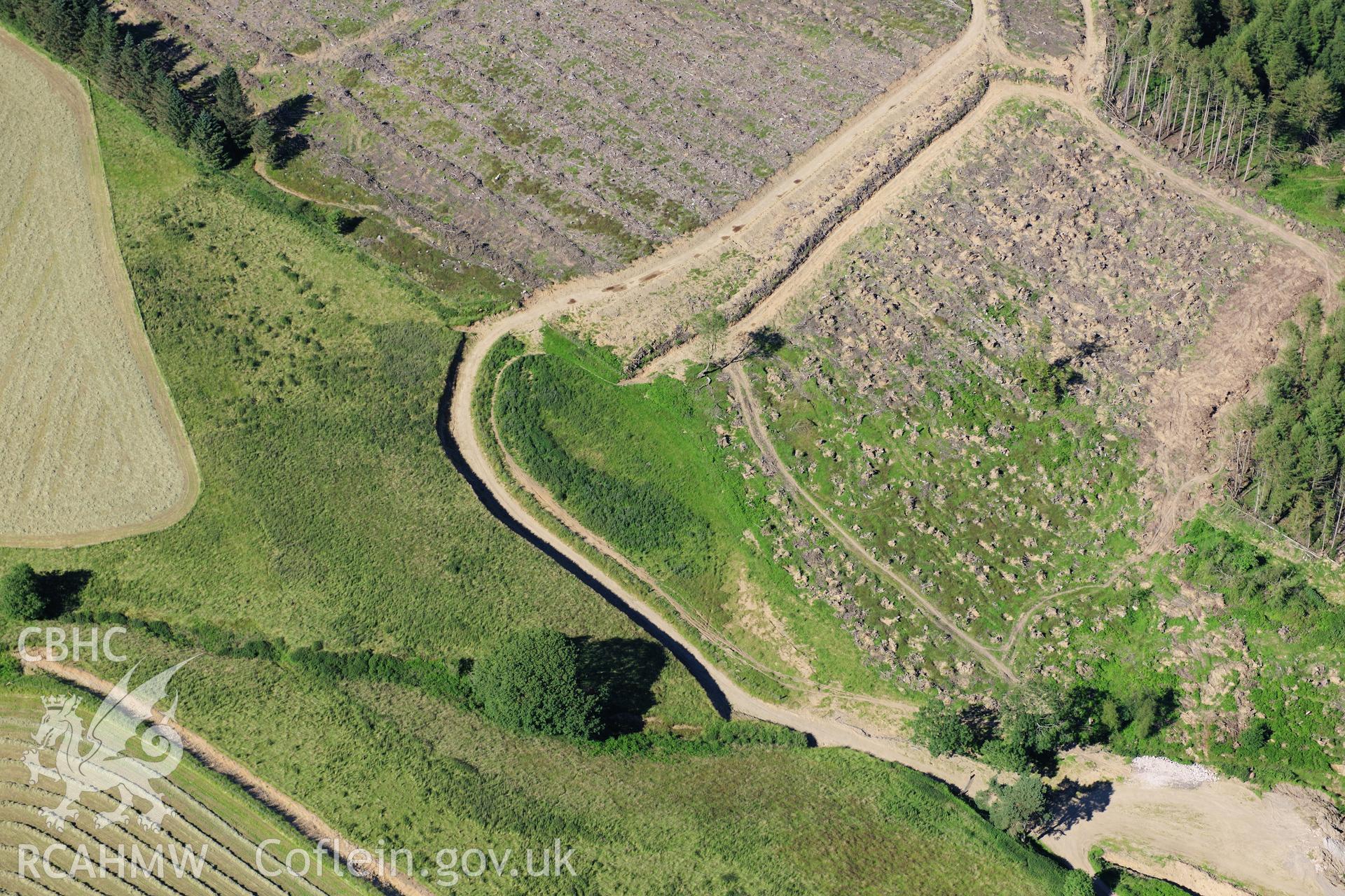 RCAHMW colour oblique photograph of Cleared forestry TO LOCATE. Taken by Toby Driver on 24/07/2012.