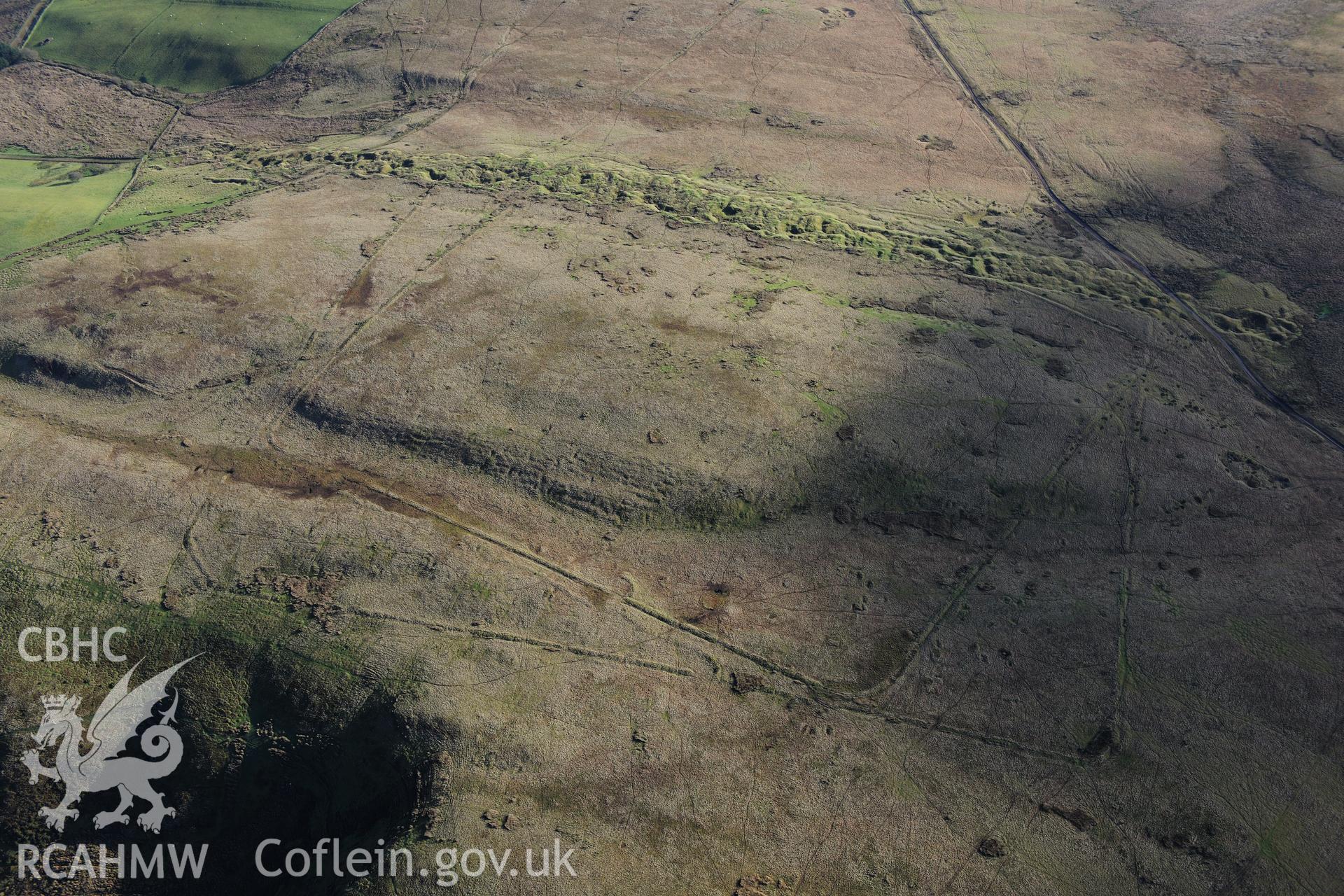RCAHMW colour oblique photograph of Y Pigwn Roman camps. Taken by Toby Driver on 23/11/2012.