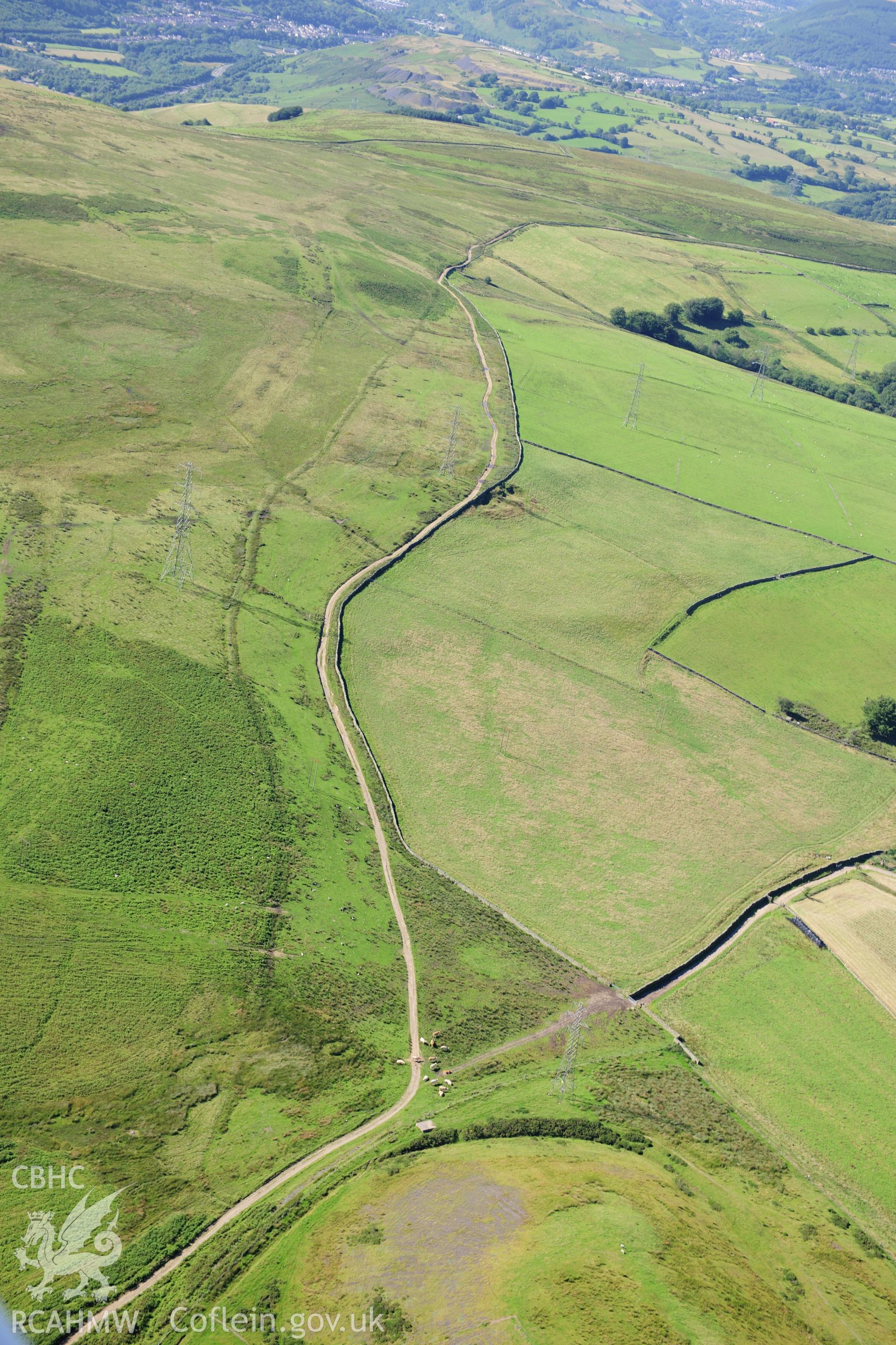 RCAHMW colour oblique photograph of Garnedd Llwyd, round barrow. Taken by Toby Driver on 24/07/2012.