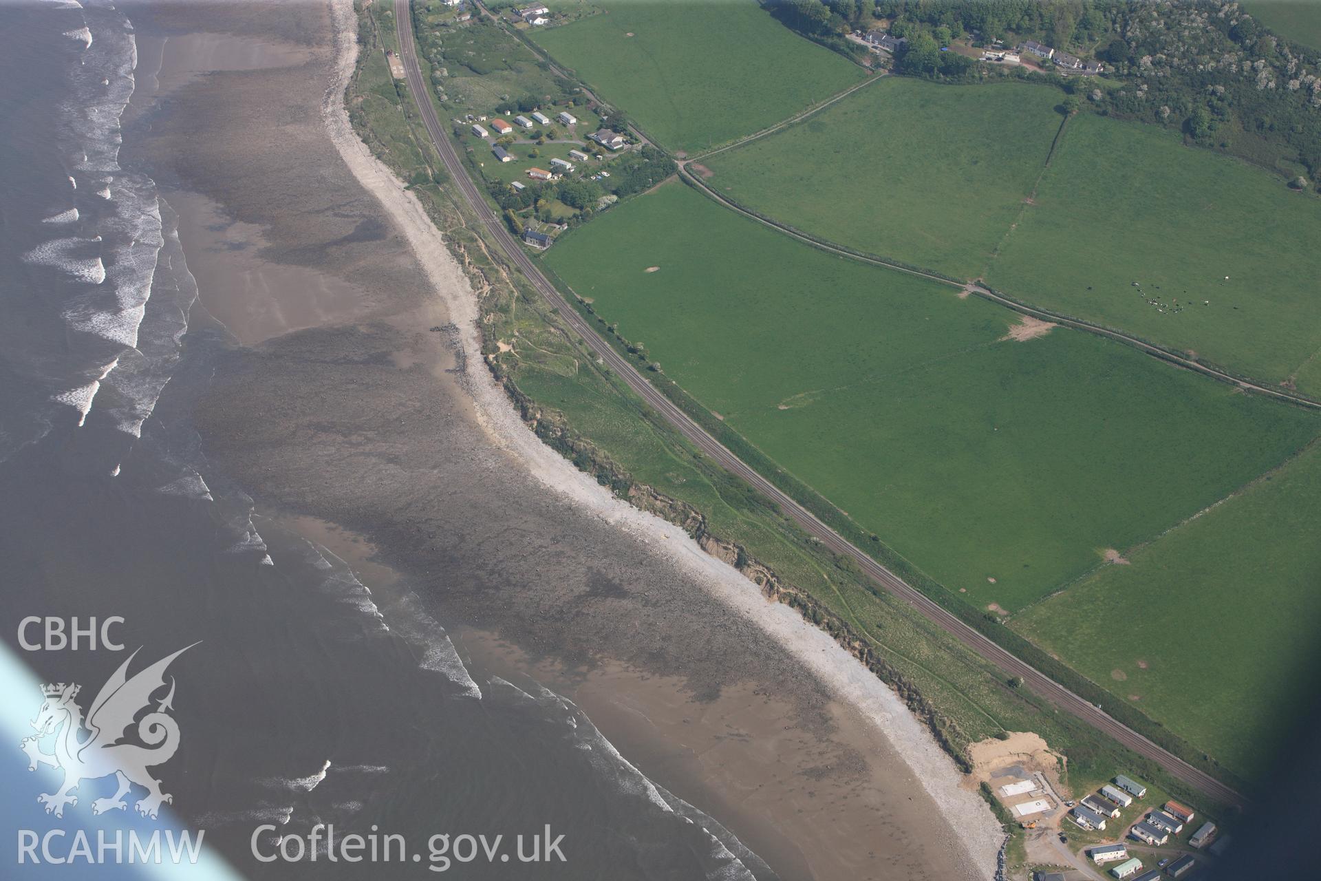 RCAHMW colour oblique photograph of General view of coastal erosion on site of St Ishmaels deserted medieval village, looking north west. Taken by Toby Driver on 24/05/2012.
