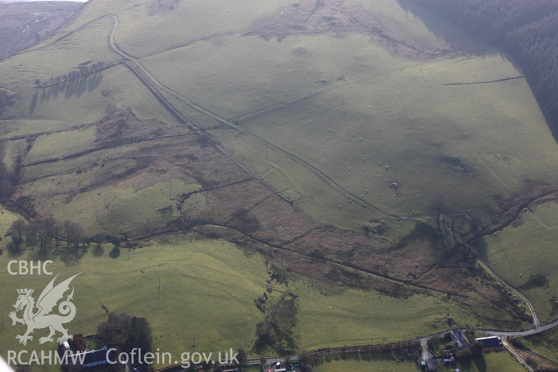 RCAHMW colour oblique photograph of Brynafan village, with deserted settlement earthworks to south-west. Taken by Toby Driver on 07/02/2012.