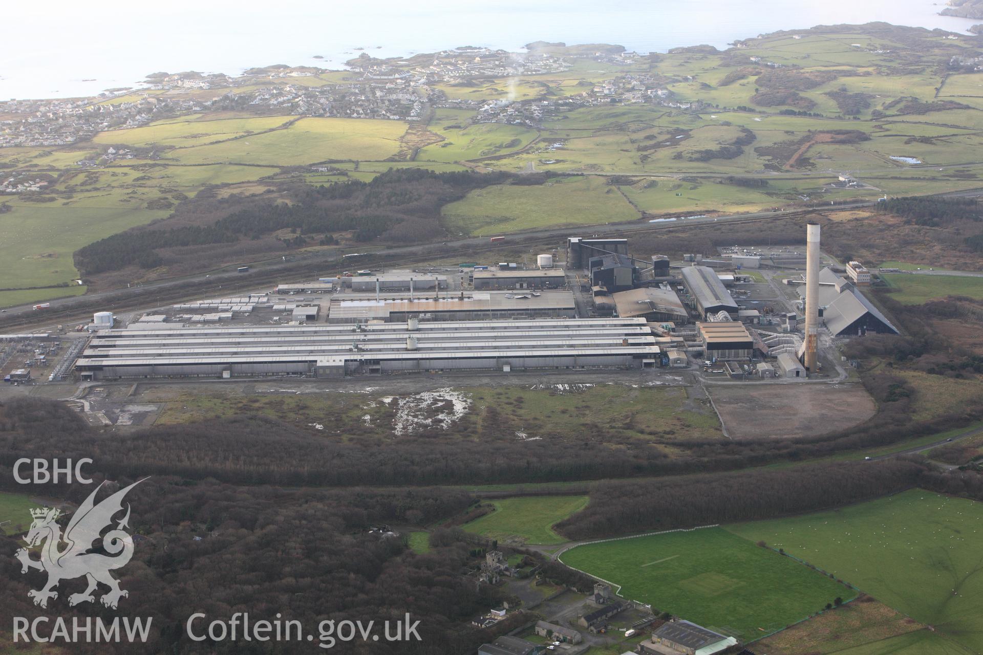 RCAHMW colour oblique photograph of Anglesey Aluminium Smelting Works, aerial survey prior to closure, stereo pair. Taken by Toby Driver on 13/01/2012.