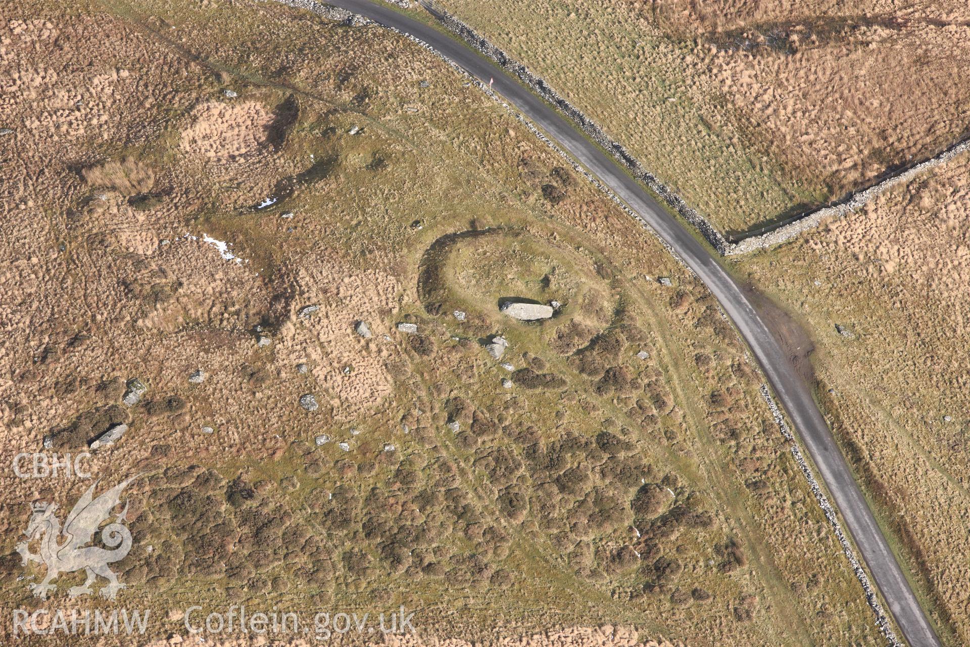 RCAHMW colour oblique photograph of Carreg-Y-Bwci Round Barrow and Roman Signal Station. Taken by Toby Driver on 07/02/2012.