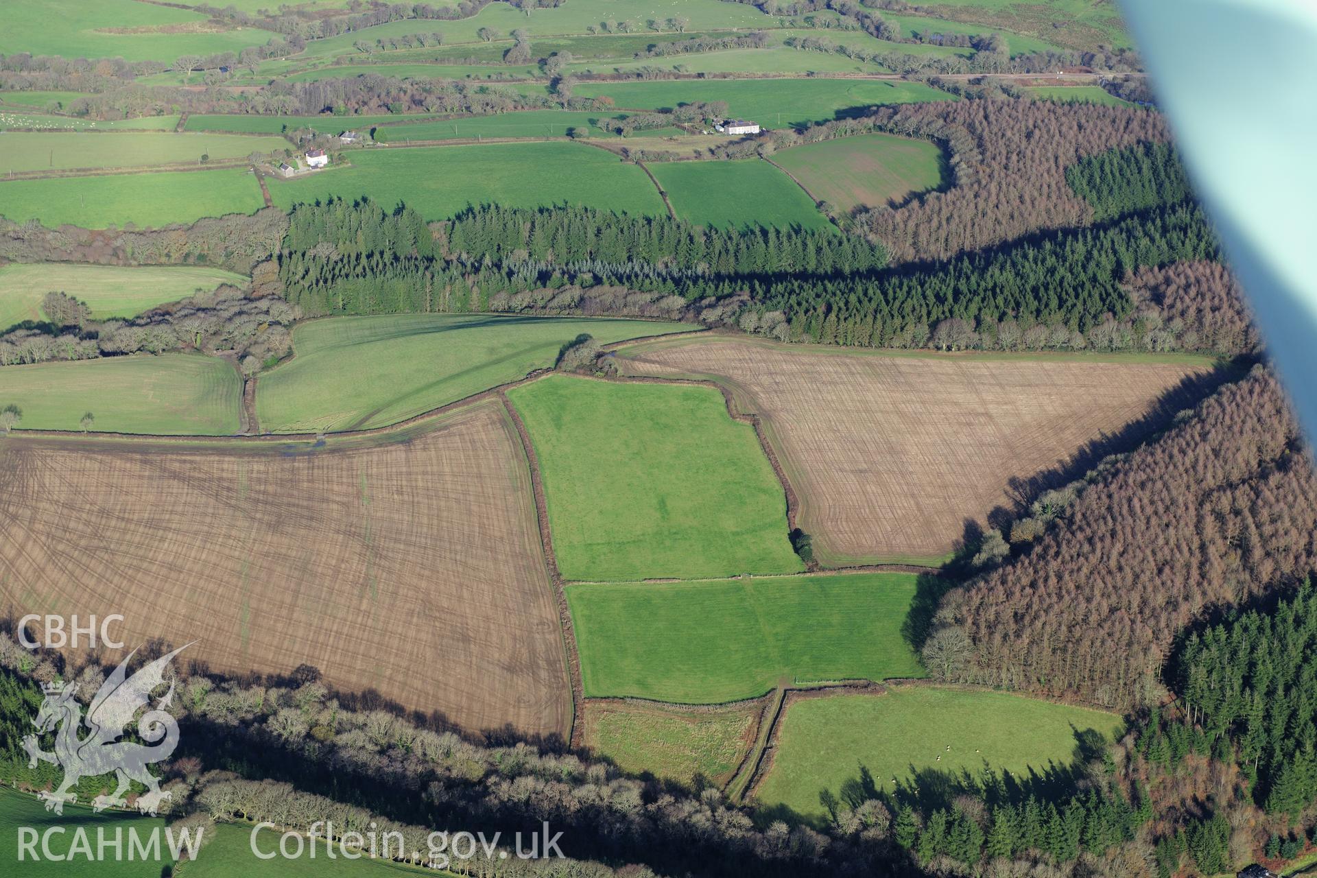 RCAHMW colour oblique photograph of Dan y Coed enclosure. Taken by Toby Driver on 28/11/2012.