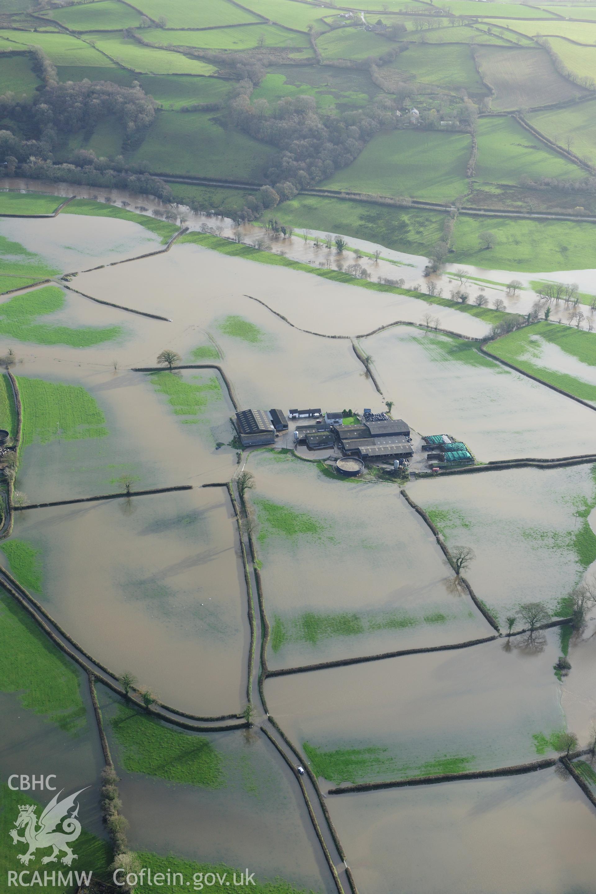 RCAHMW colour oblique photograph of Glantowy Fawr farm, with flooding, view from north-west. Taken by Toby Driver on 23/11/2012.