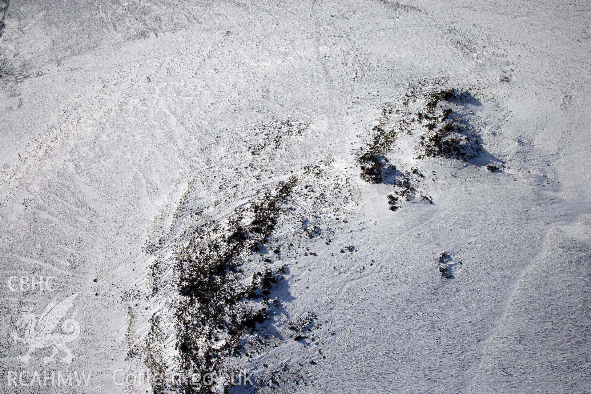 RCAHMW colour oblique photograph of Carn Meini Bluestone Outcrops of Spotted Dolerite. Taken by Toby Driver on 02/02/2012.