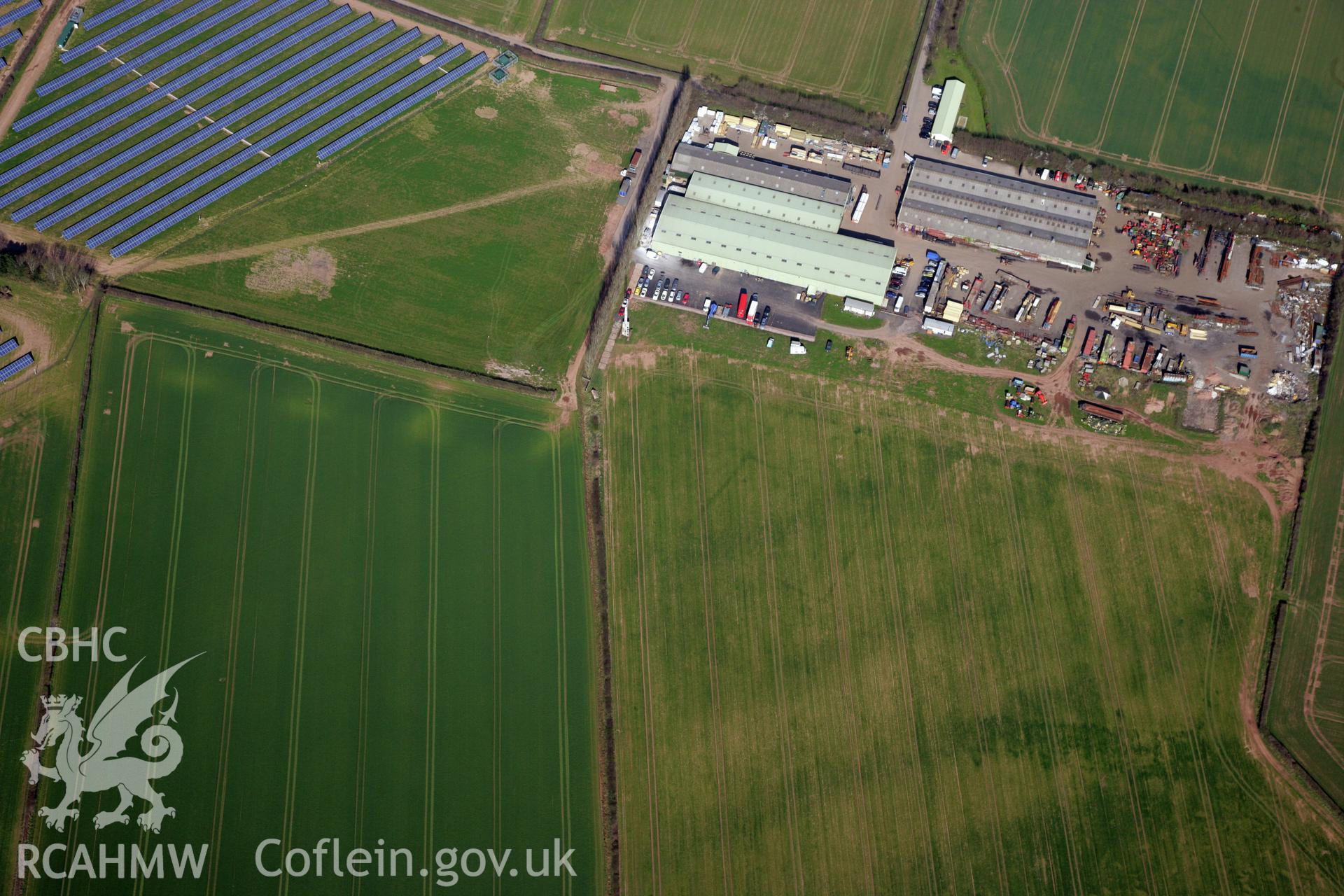 RCAHMW colour oblique photograph of Llancayo Farm defended enclosure cropmarks. Taken by Toby Driver and Oliver Davies on 28/03/2012.