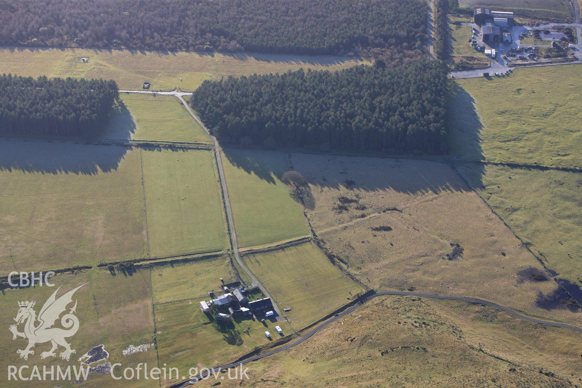 RCAHMW colour oblique photograph of Tanforhesgan earthwork enclosure. Taken by Toby Driver on 10/12/2012.