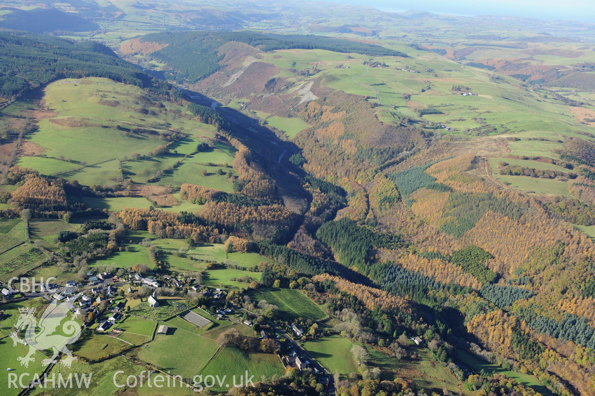 RCAHMW colour oblique photograph of Ysbyty Ystwyth village, landscape looking west with autumn colours. Taken by Toby Driver on 05/11/2012.