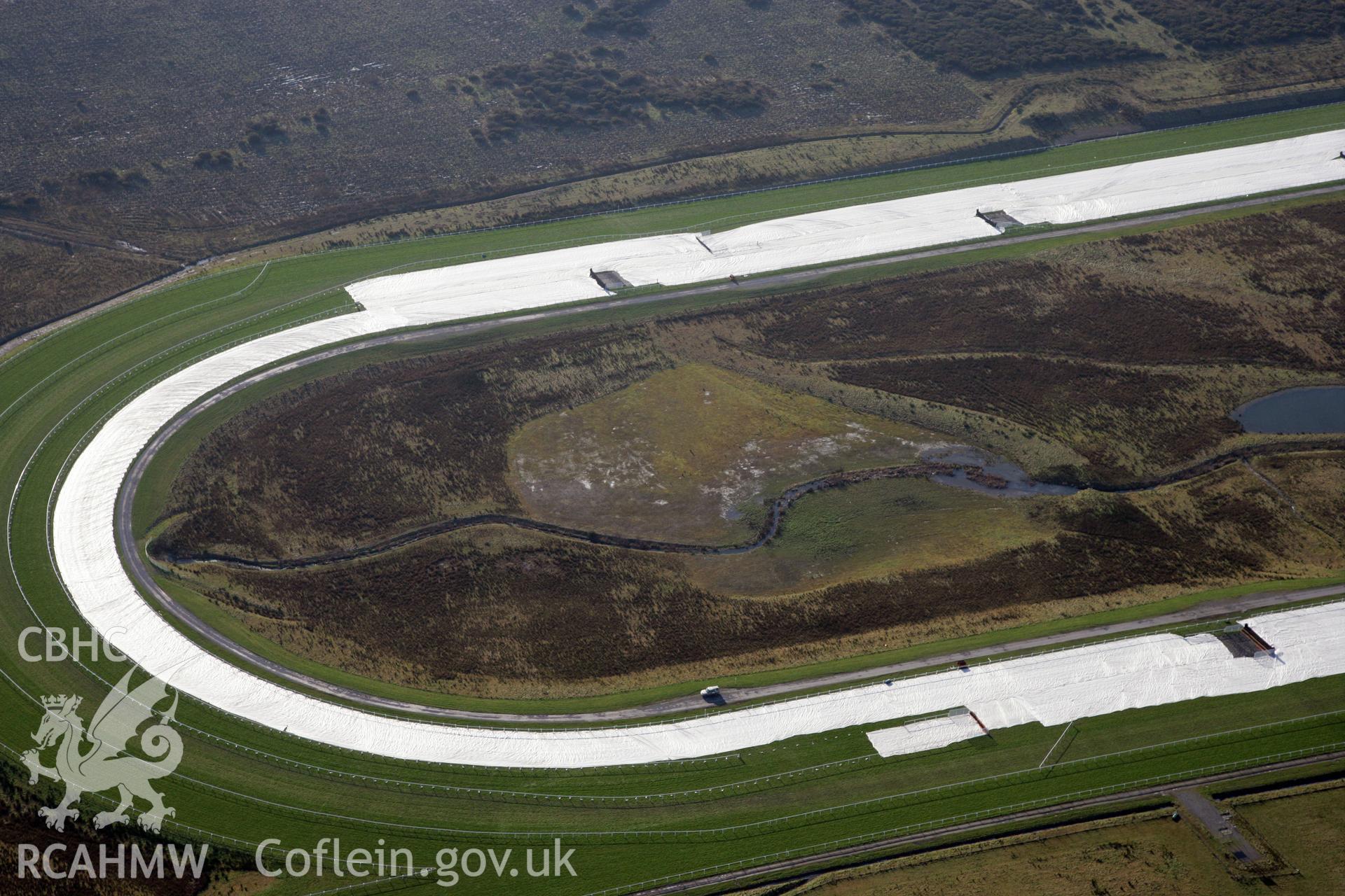 RCAHMW colour oblique photograph of Ffoslas Racecourse. Taken by Toby Driver on 02/02/2012.