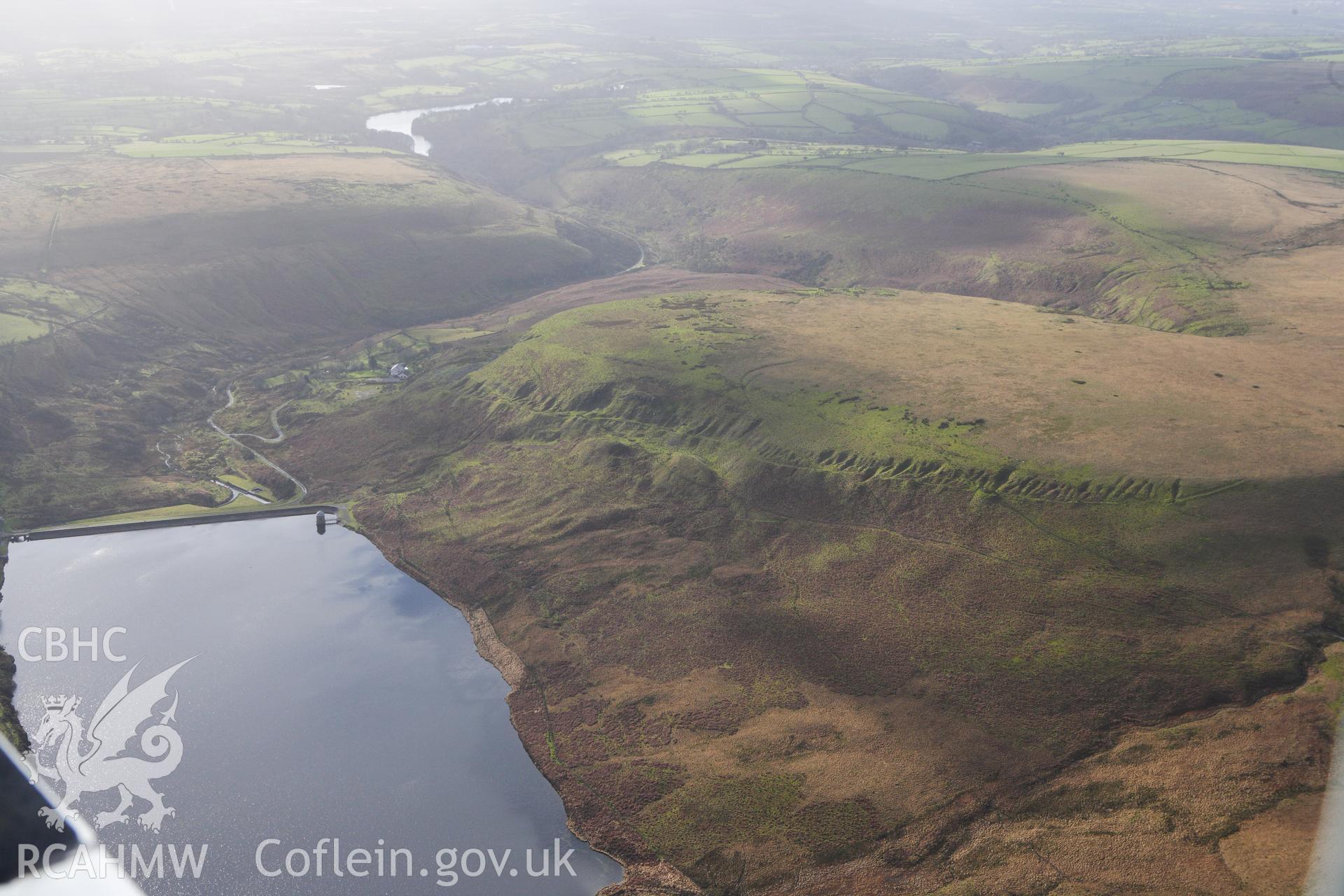 RCAHMW colour oblique photograph of old quarry workings on the lower slopes of Banc Darren-fawr, above the Upper Lliw reservoir. Taken by Toby Driver on 27/01/2012.