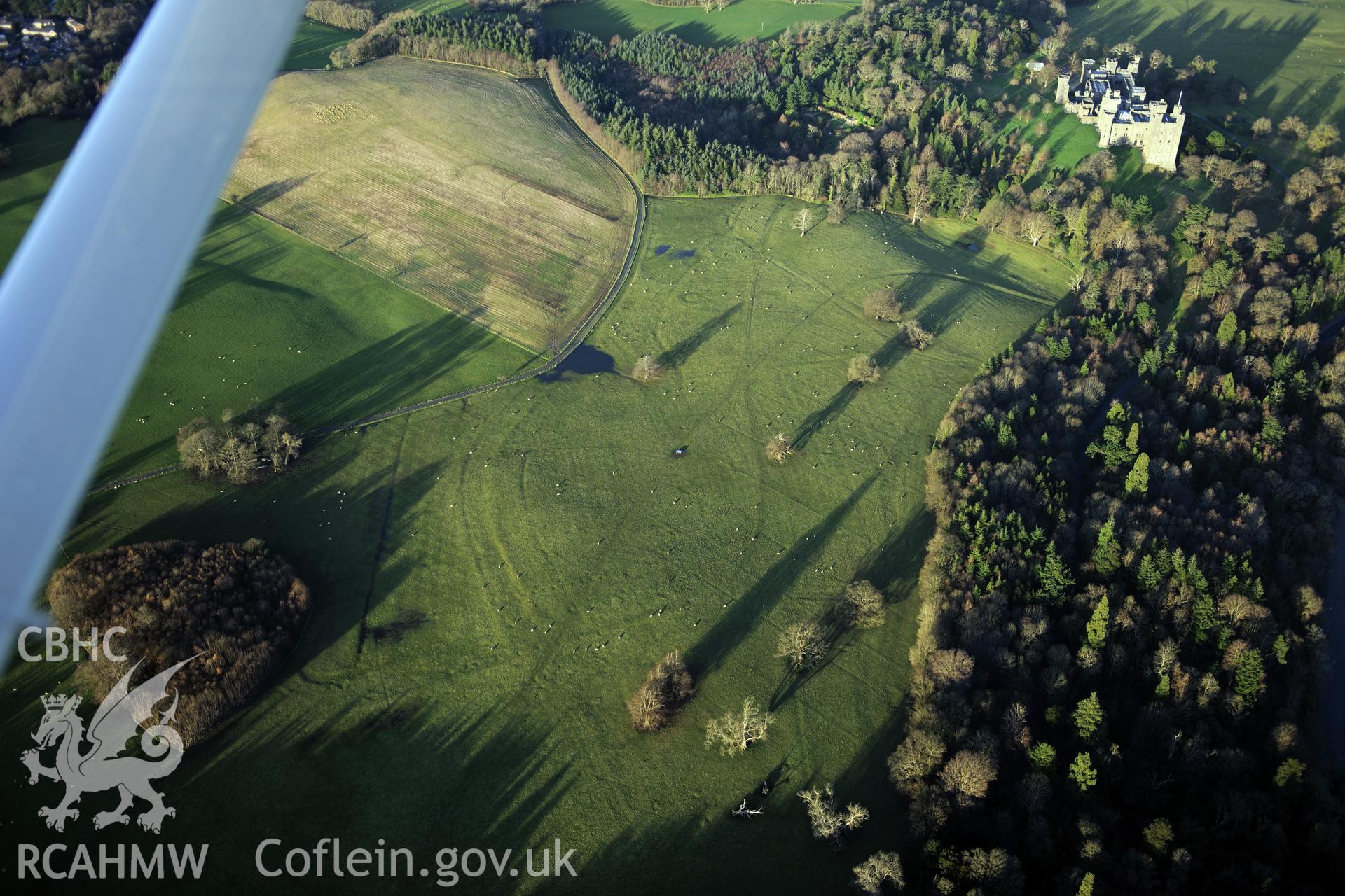 RCAHMW colour oblique photograph of Penrhyn Park earthworks. Taken by Toby Driver on 10/12/2012.