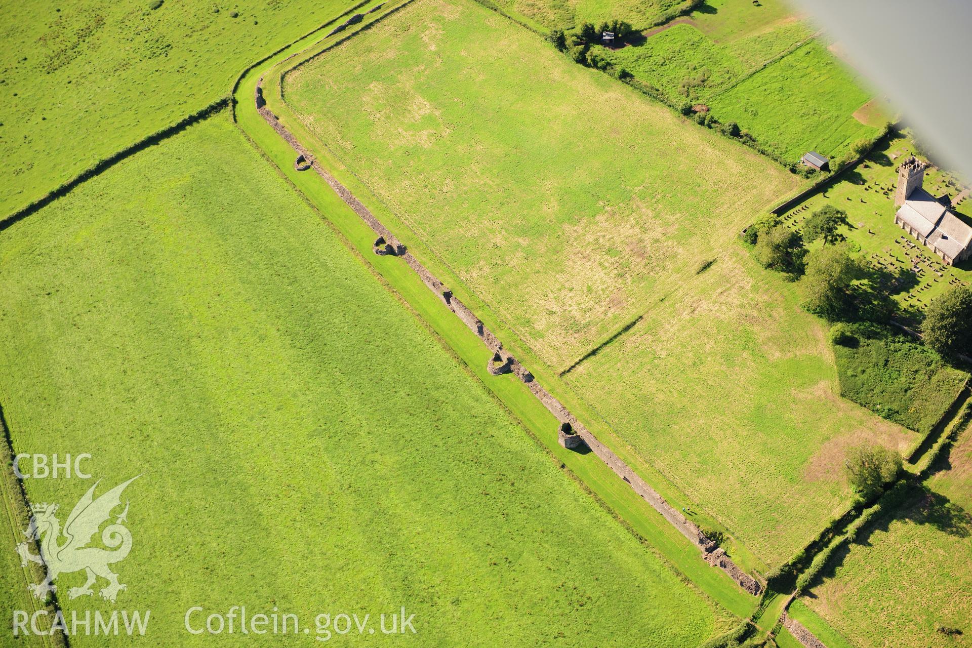 RCAHMW colour oblique photograph of Caerwent Roman town, south gate and walls. Taken by Toby Driver on 24/07/2012.