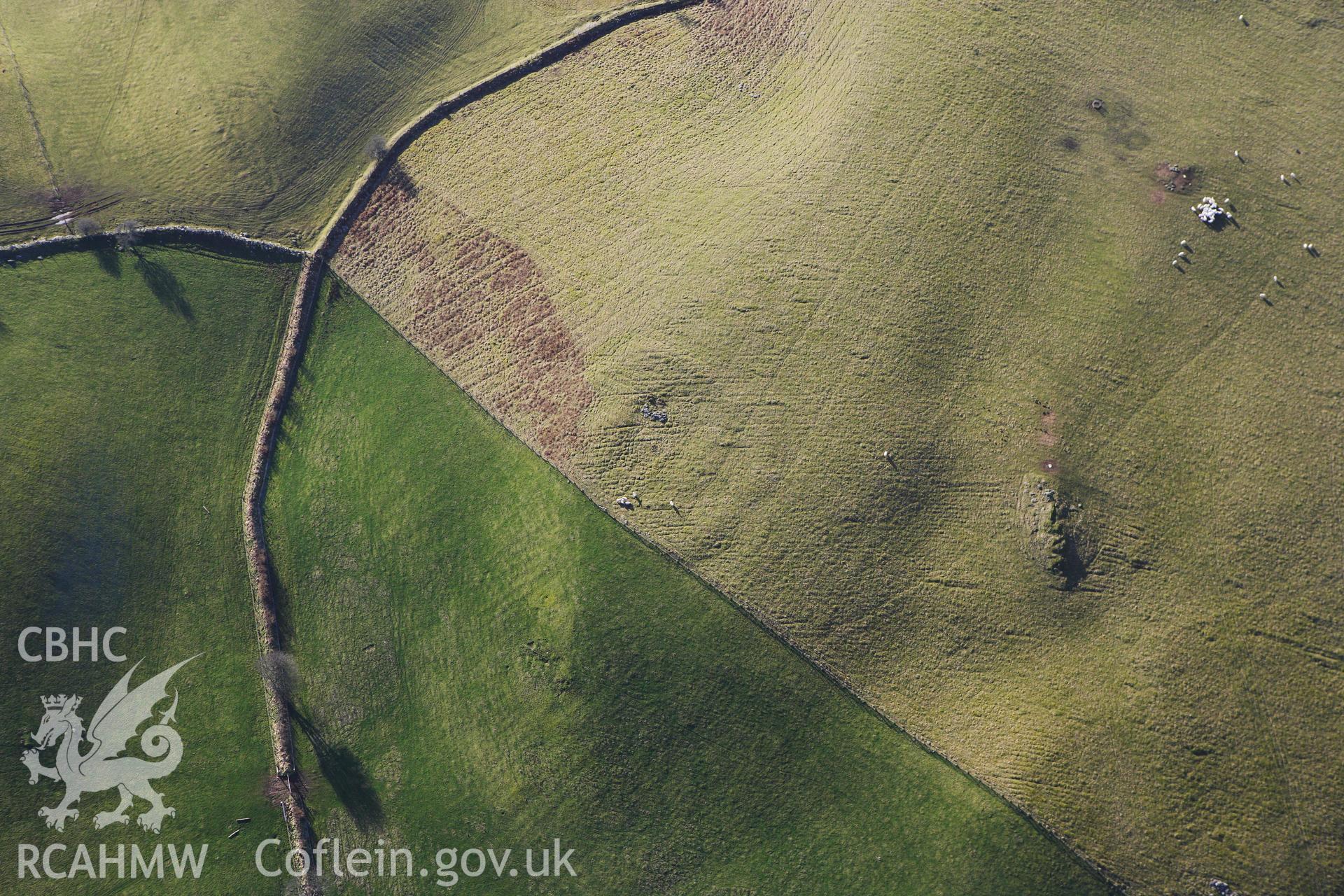 RCAHMW colour oblique photograph of Penlan Square Earthwork Enclosure. Taken by Toby Driver on 07/02/2012.