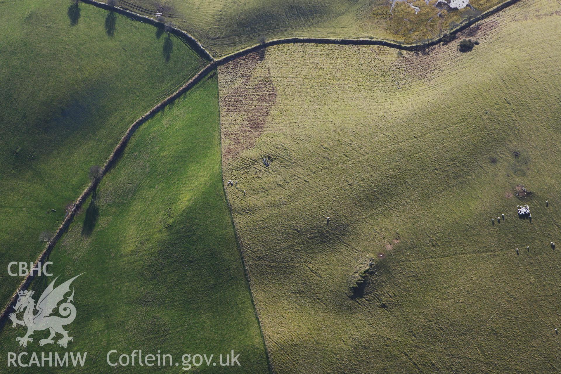 RCAHMW colour oblique photograph of Penlan Square Earthwork Enclosure. Taken by Toby Driver on 07/02/2012.