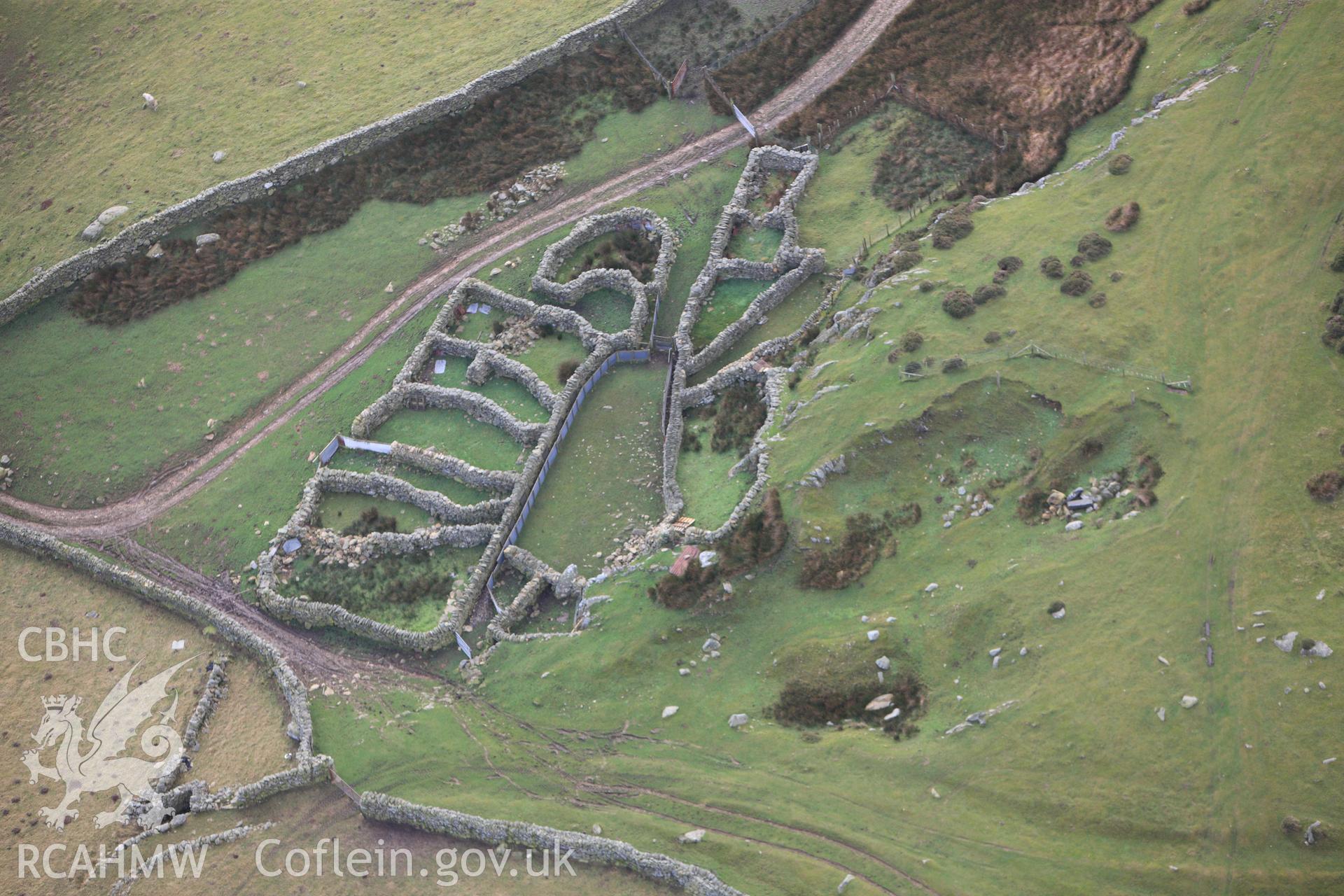 RCAHMW colour oblique photograph of Tyddyn-Grasod, multicellular sheepfold. Taken by Toby Driver on 13/01/2012.