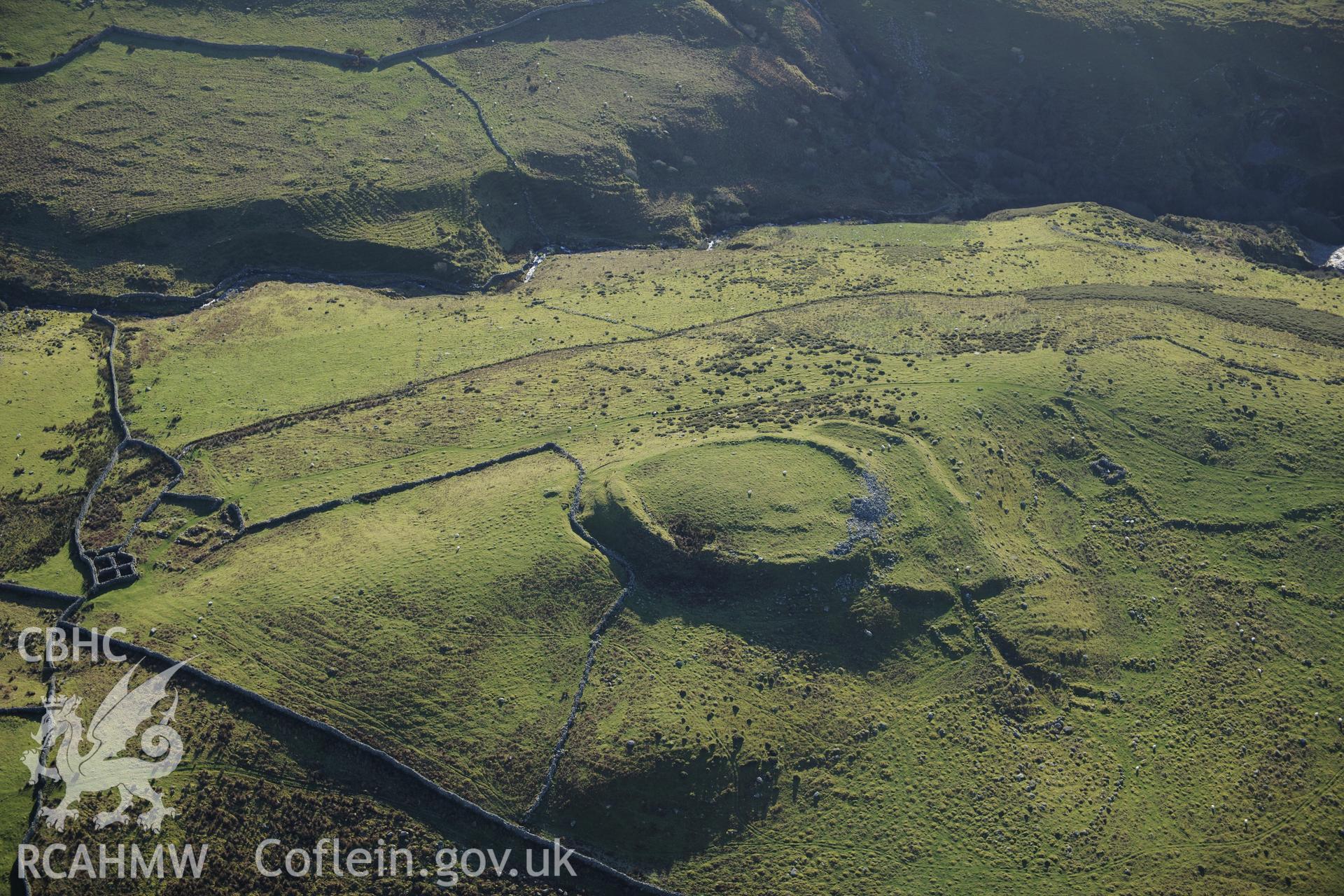 RCAHMW colour oblique photograph of Pen y Dinas, hillfort and upland landscape. Taken by Toby Driver on 10/12/2012.