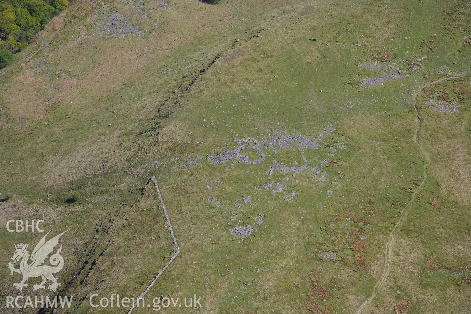 RCAHMW colour oblique photograph of Allt Fach, enclosure complex. Taken by Toby Driver on 22/05/2012.