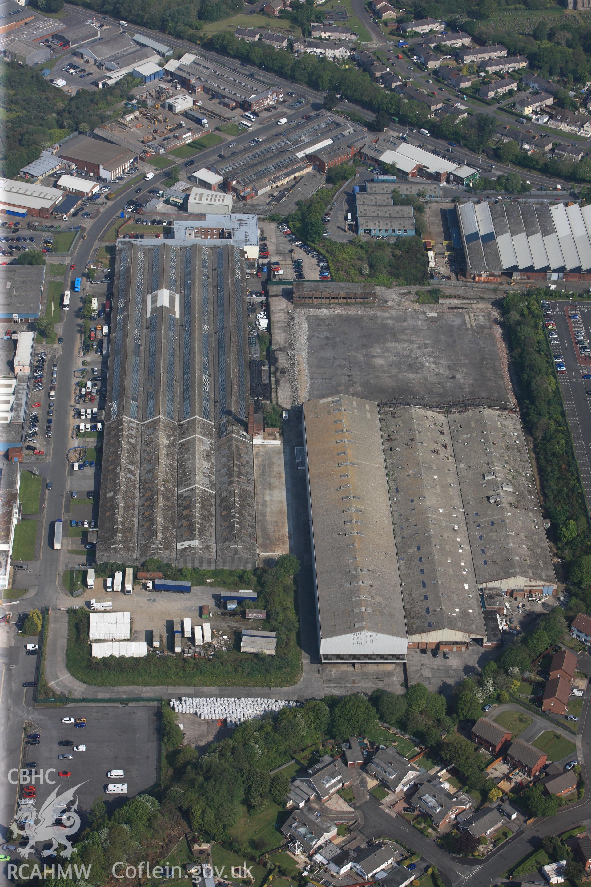 RCAHMW colour oblique photograph of General view of factories on Swansea West Industrial Estate looking north west towards former War Materials factory. Taken by Toby Driver on 24/05/2012.